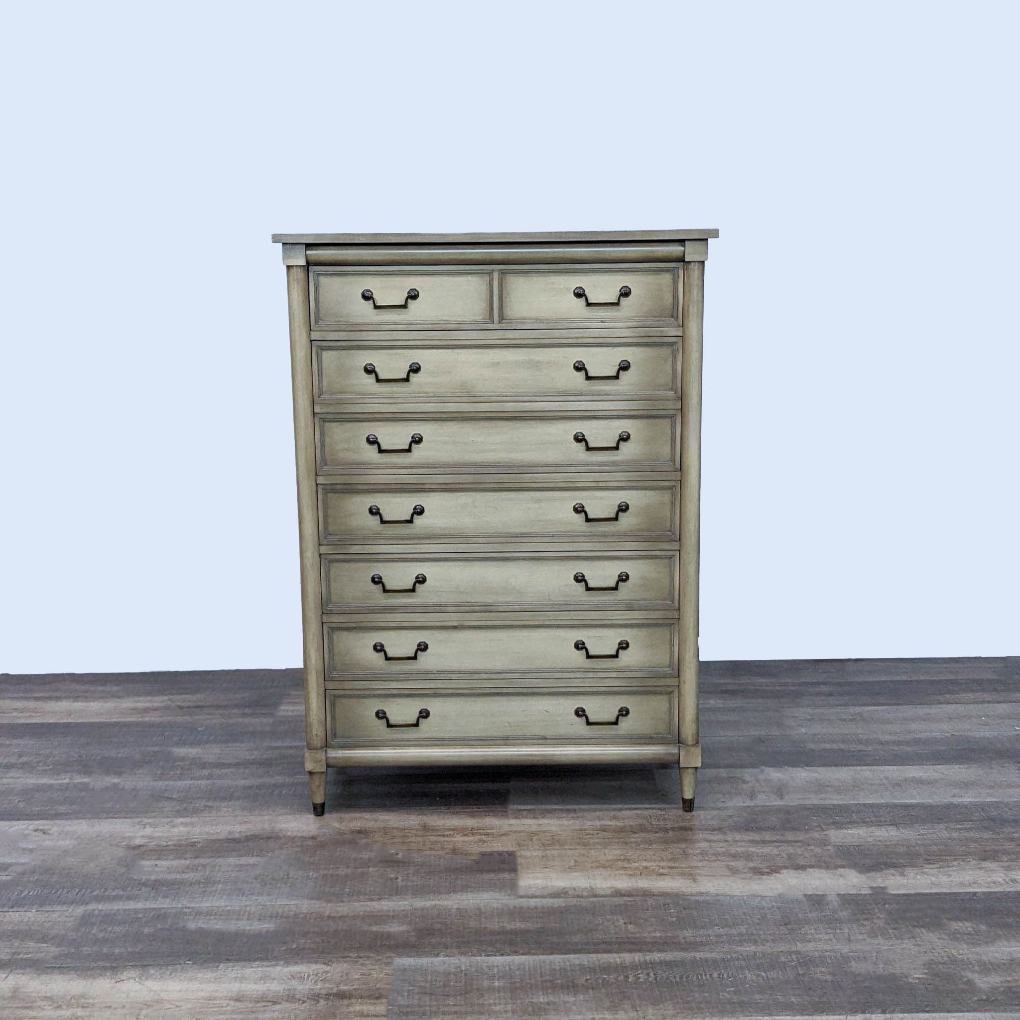 Alt text 1: A vintage wooden Reperch dresser with six drawers and antiqued handles, in a country cottage style, against a neutral background.