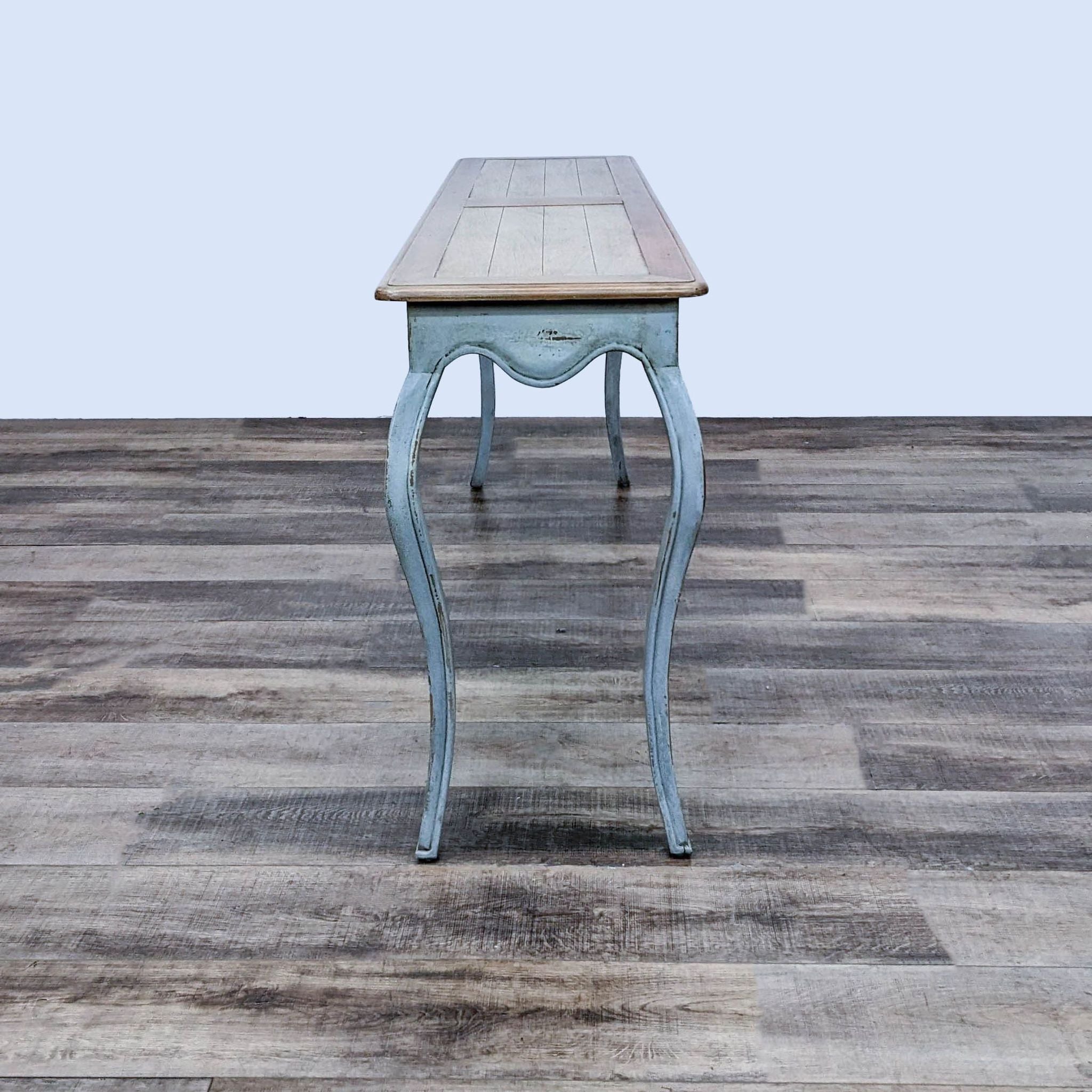 Contemporary French Provincial style side table by Port and Manor, with inlaid plank top and scalloped apron on cabriole legs.