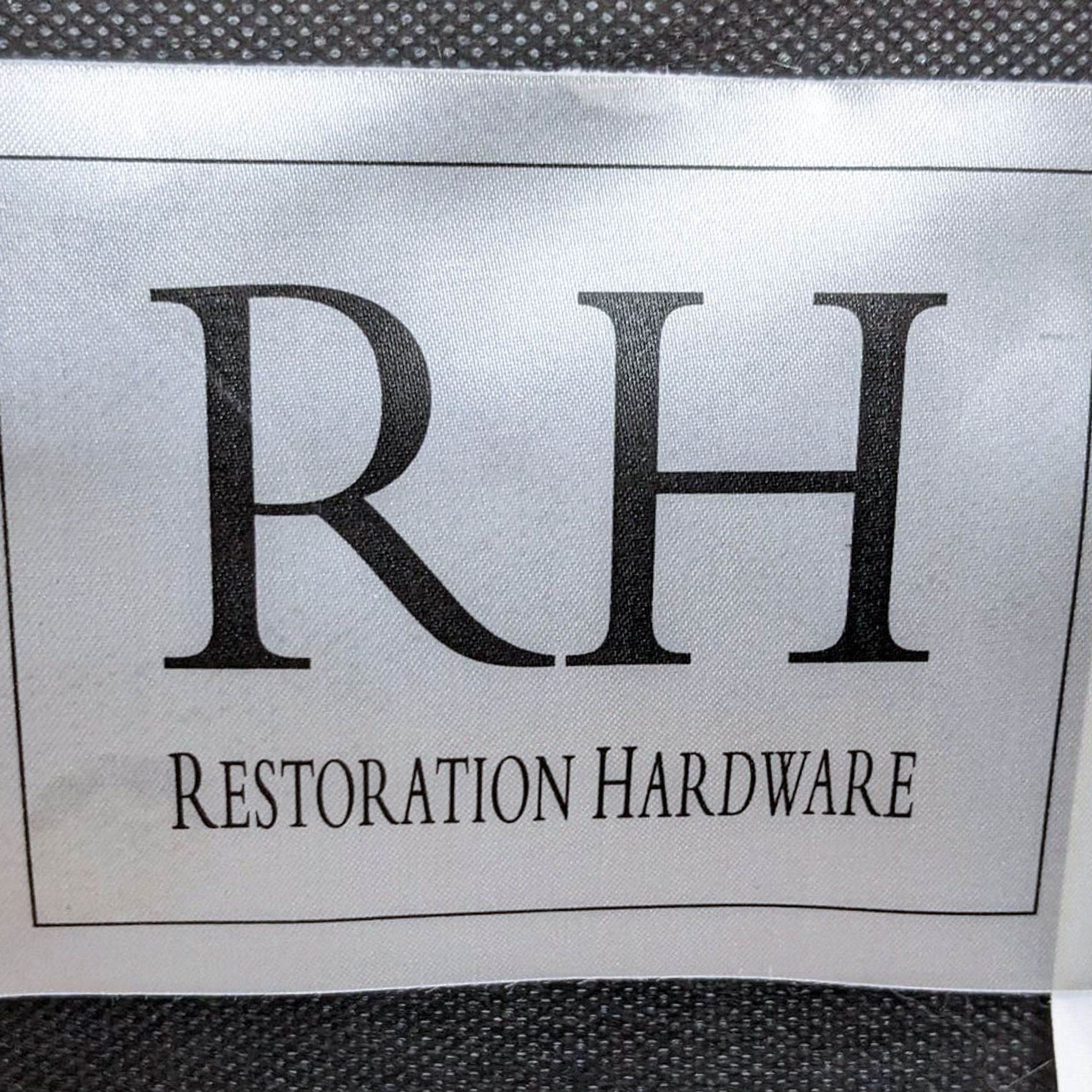 Restoration Hardware brand and information tags for an 8-foot feather down bench seat sofa.