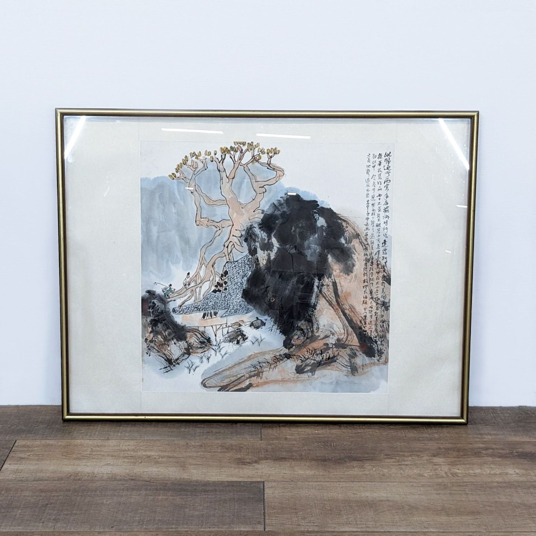 Framed Reperch art print depicting an Asian landscape with detailed ink work, displayed against a wooden floor.