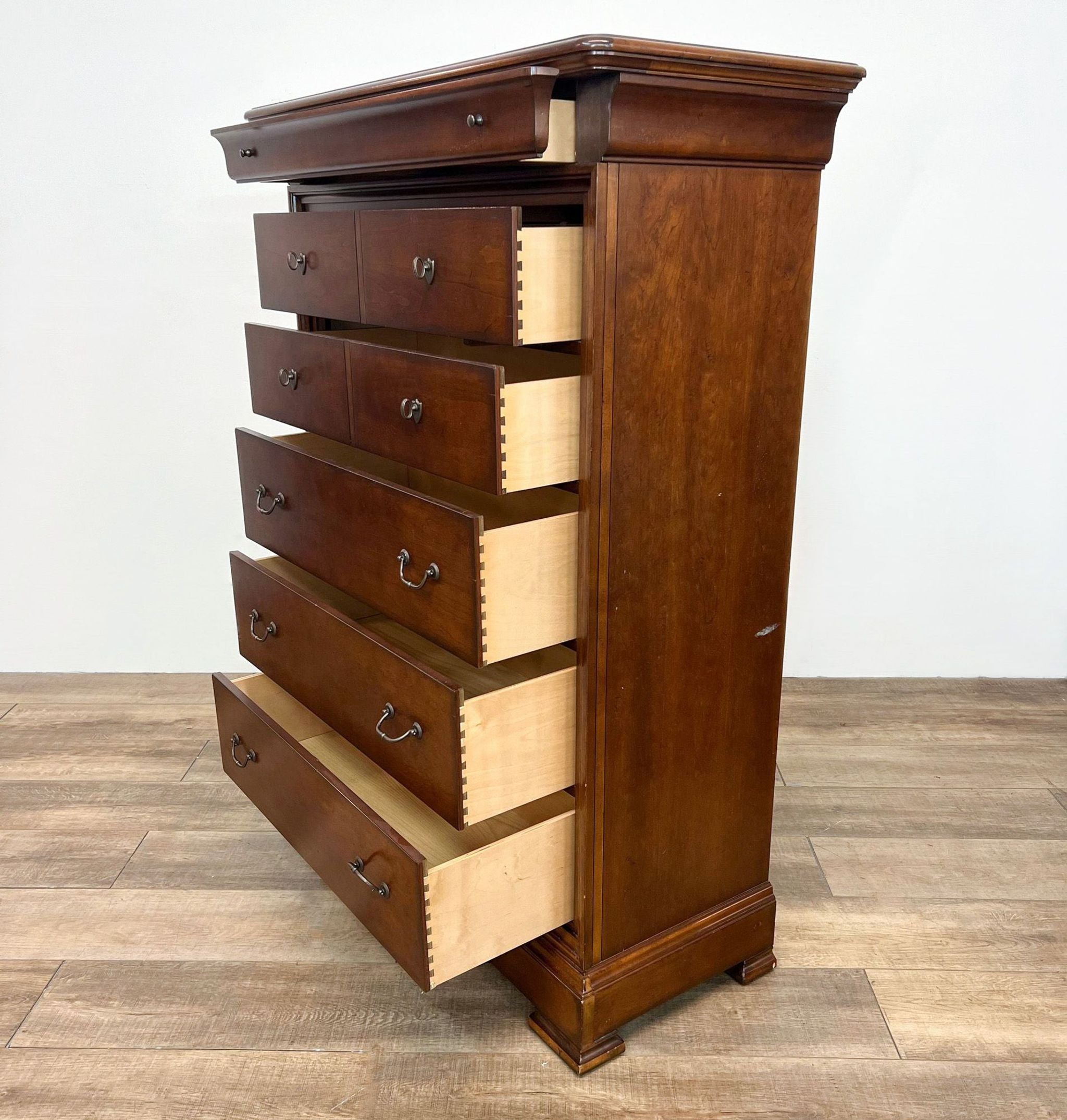 Thomasville traditional chest of drawers with open dovetail drawers showing craftsmanship, in Louis Philippe style.