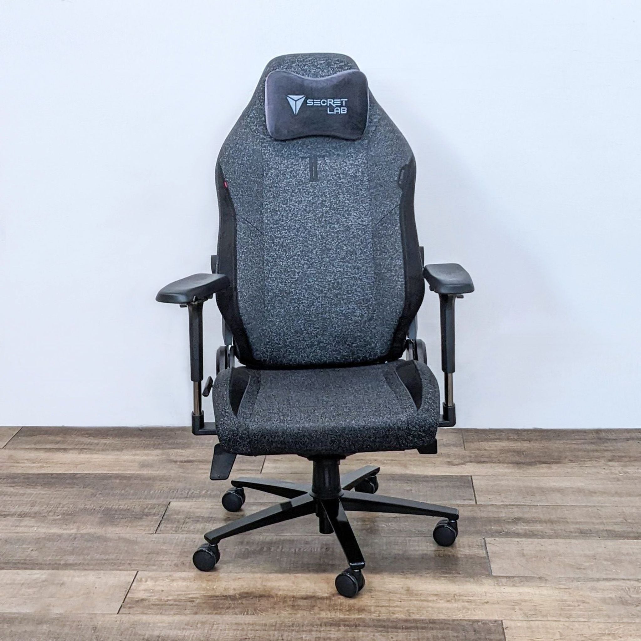 Alt text 1: Secretlab Titan Evo gaming chair in gray with cold-cure foam, recline function, and a memory foam pillow.