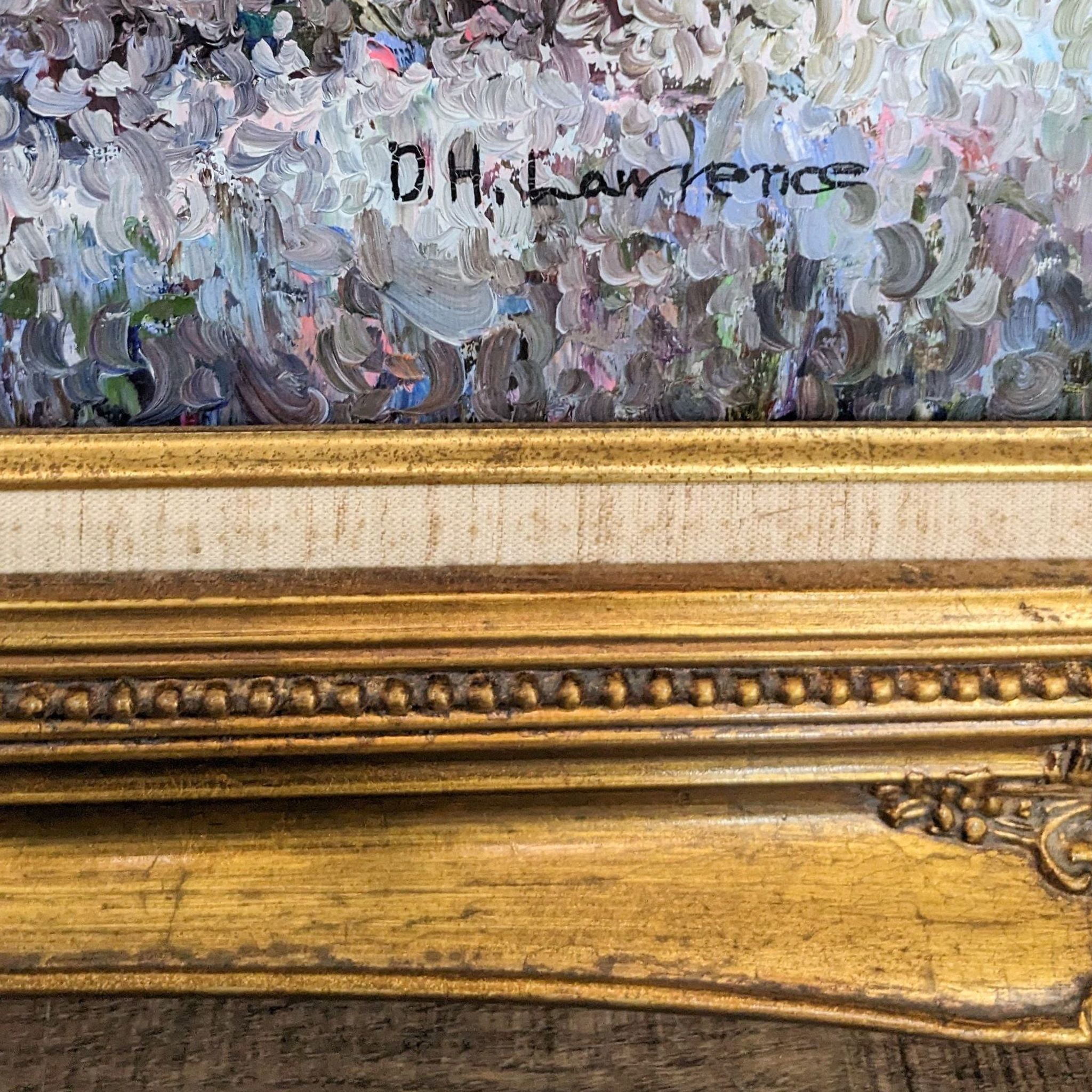 2. "Close-up of signature 'D.H. Lawrence' on a framed pastoral oil painting with ornate details on frame."