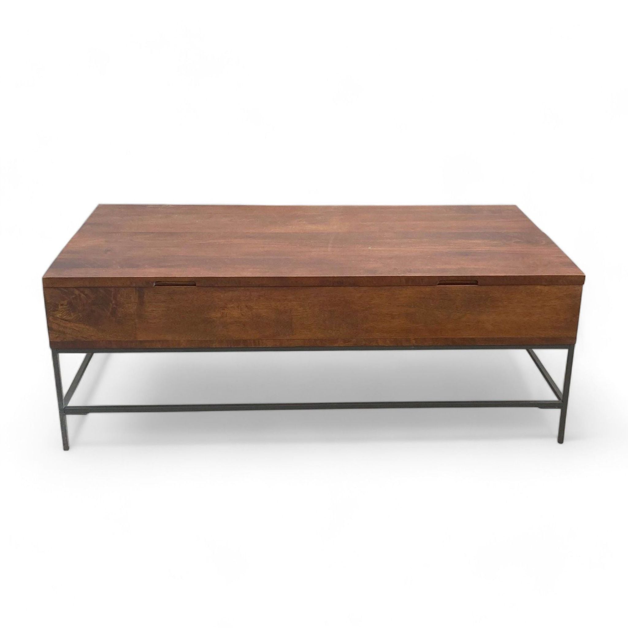 Williams Sonoma coffee table with lift top closed, on a metal frame, on a plain background.