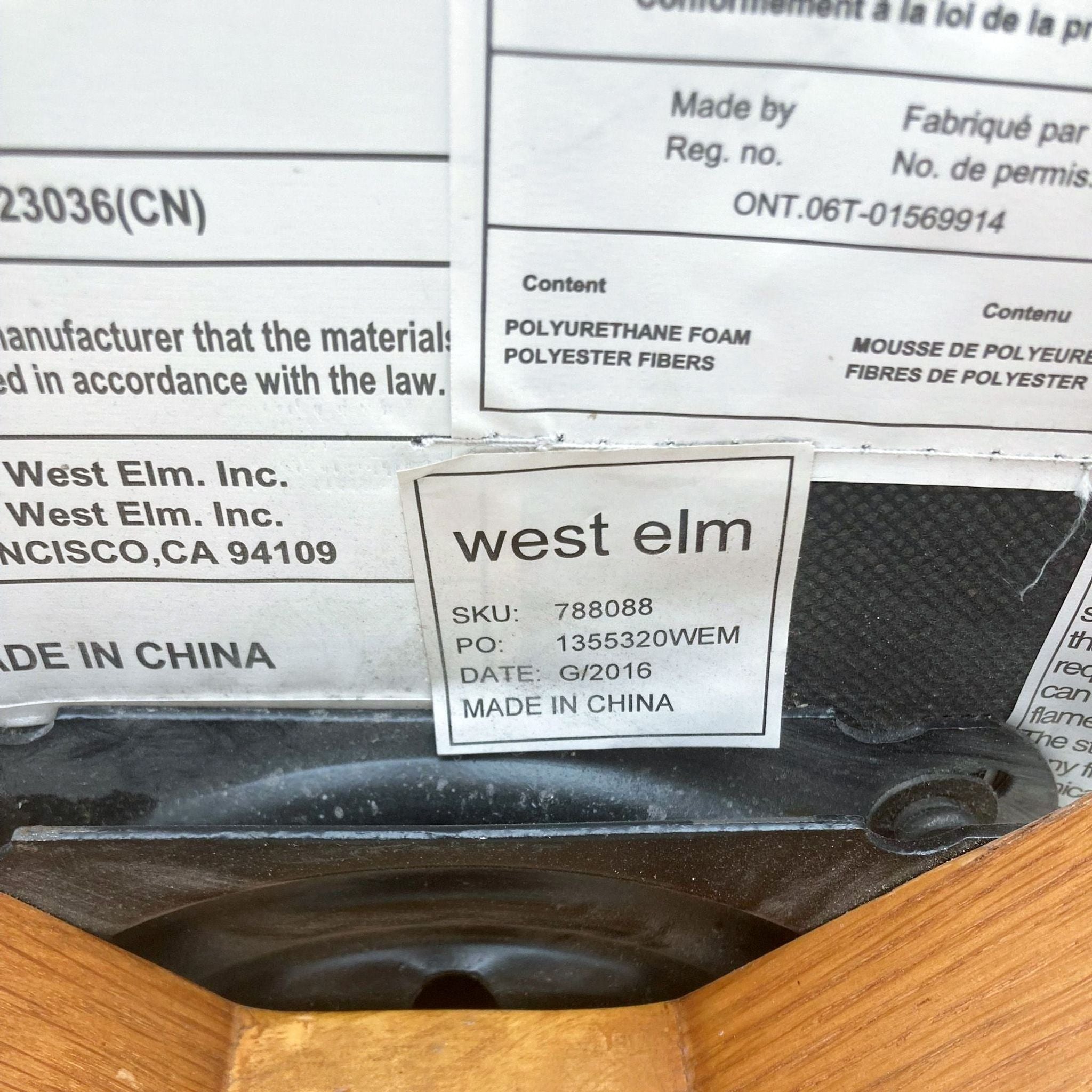 Label on West Elm swivel lounge chair displaying SKU, production details, and materials list.