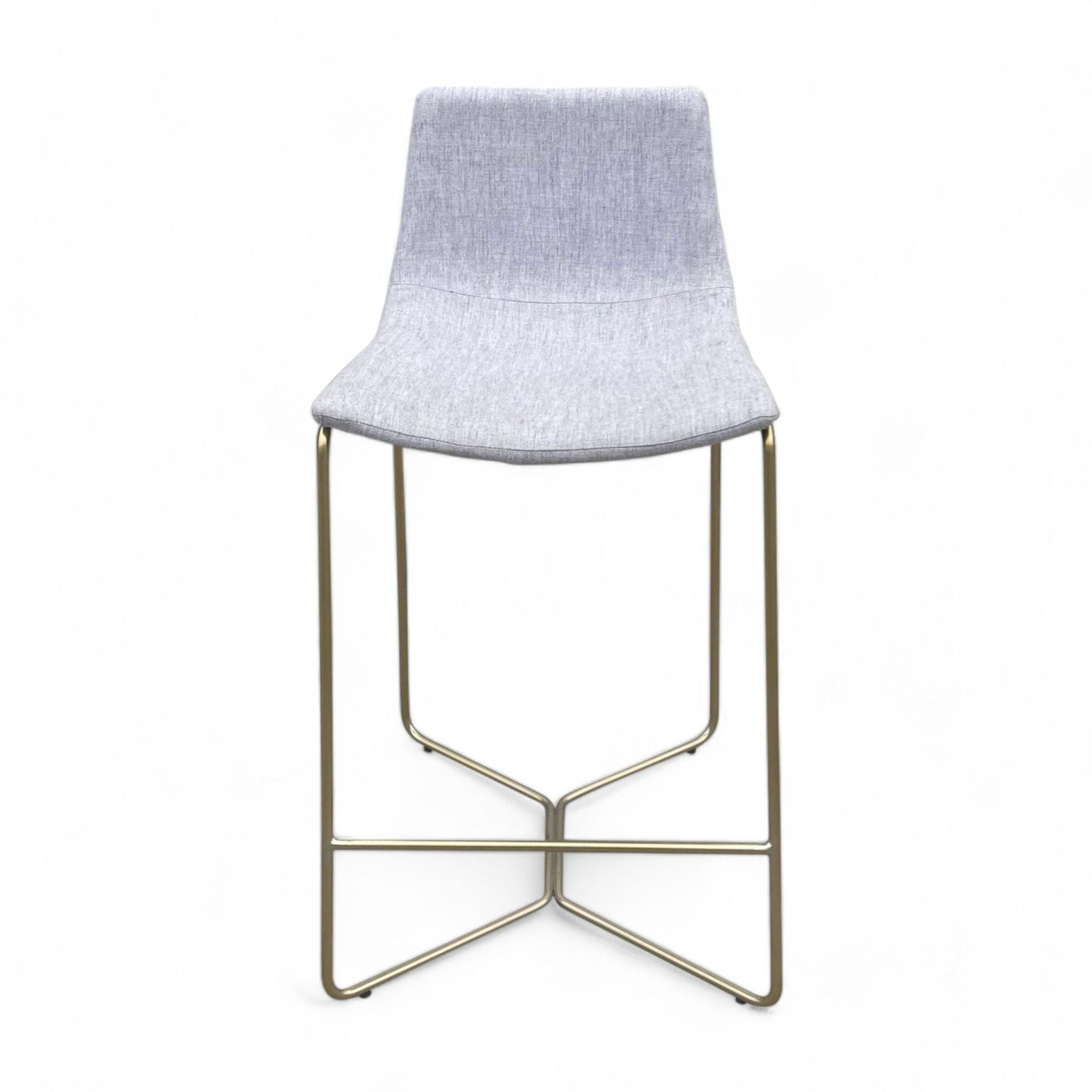 Gray upholstered West Elm counter stool with a slope seat and glam gold base.