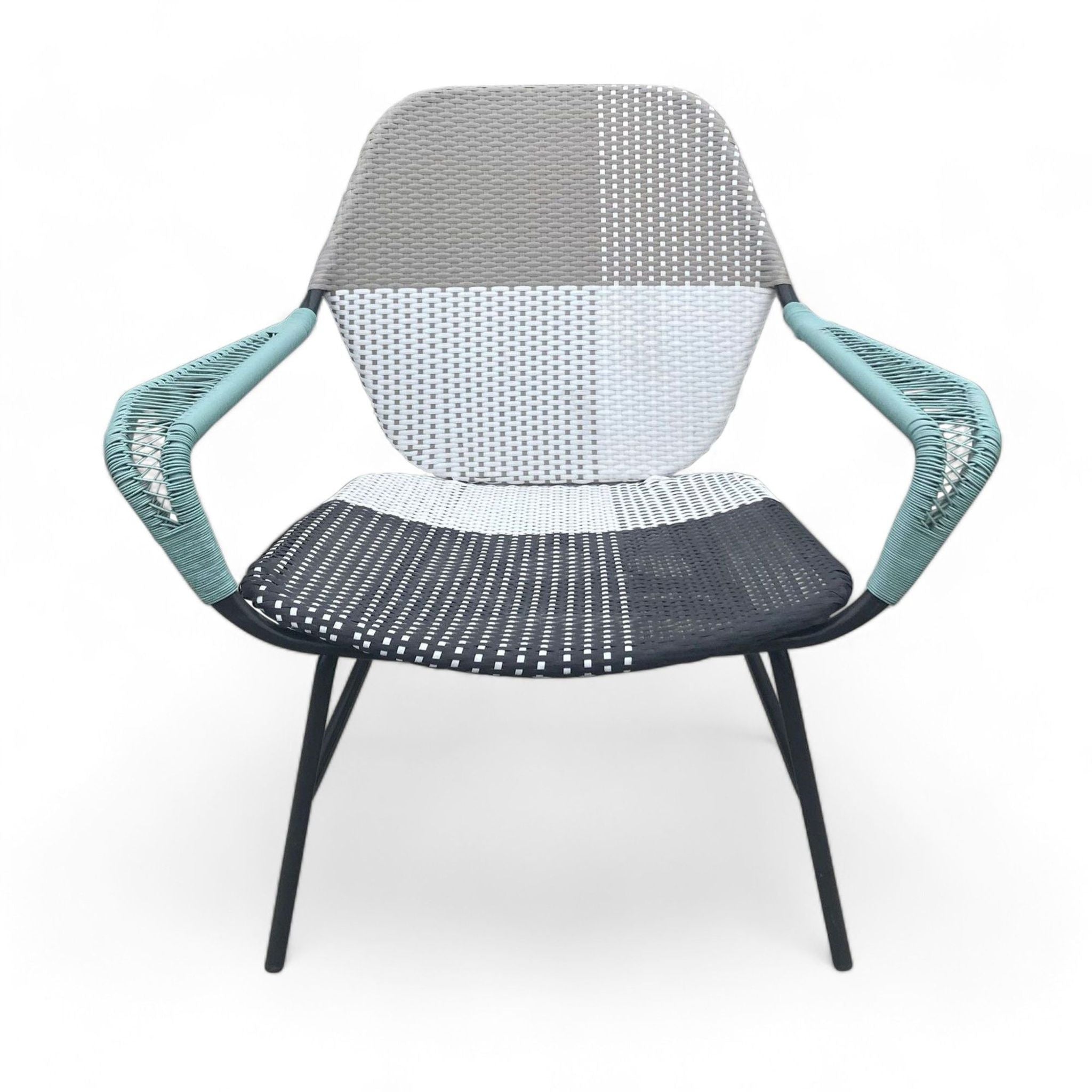 Alt text 1: Reperch brand color block resin wicker chair with a whimsical pattern and metal frame, designed for outdoor use.