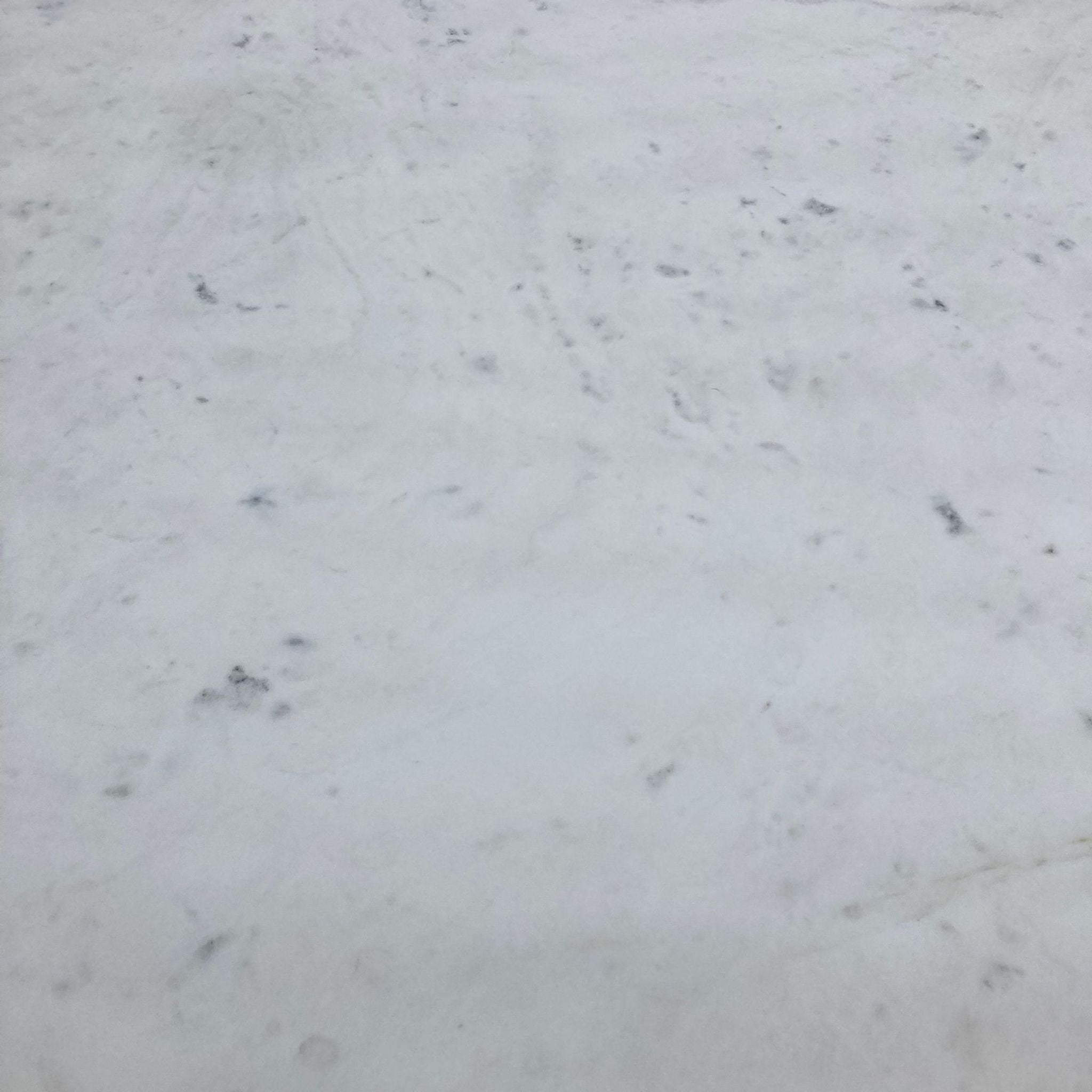 Close-up view of Reperch marble-top's texture for a modern dining table.