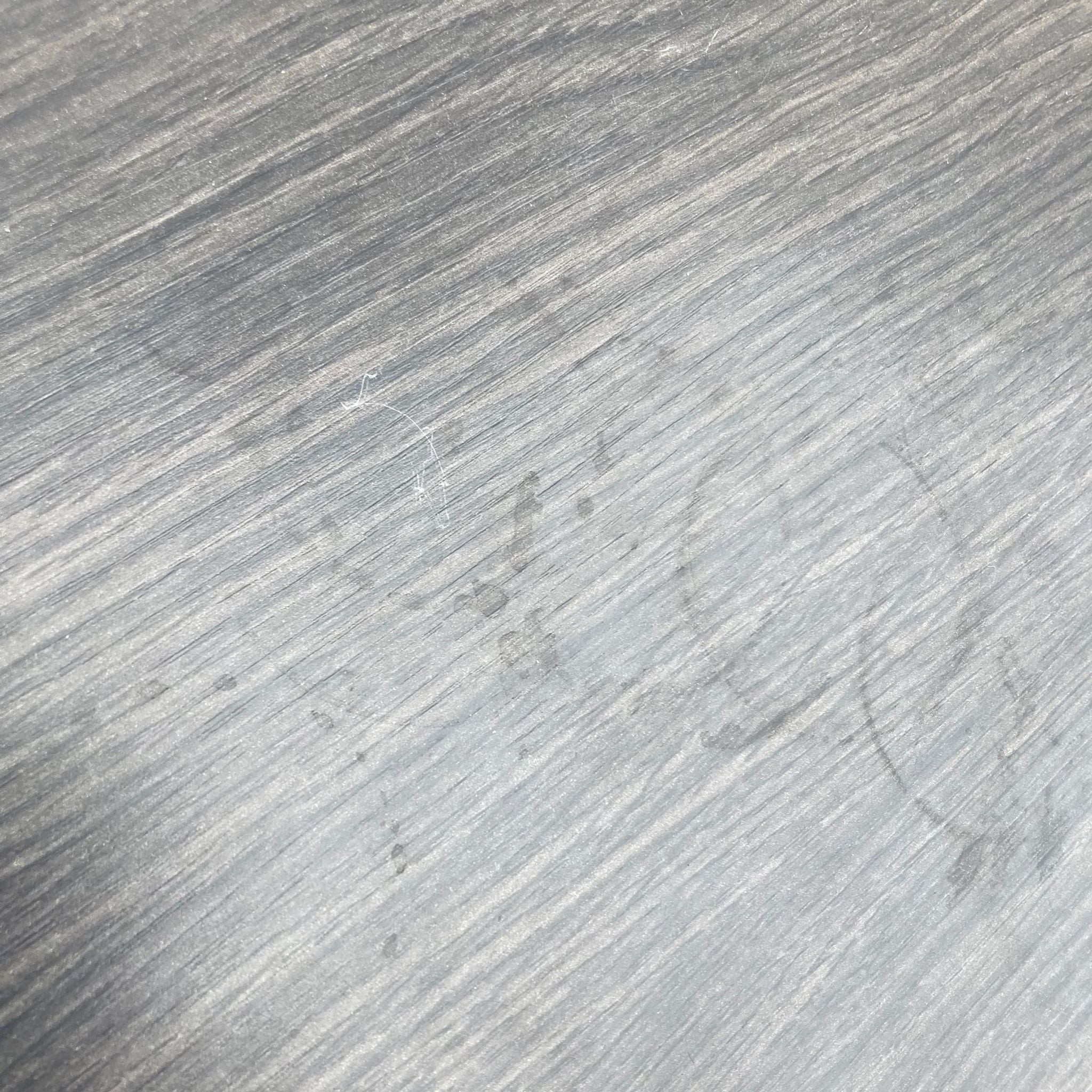 3. Close-up of the wood grain texture on the surface of a Reperch side table, highlighting the quality and finish of the material.