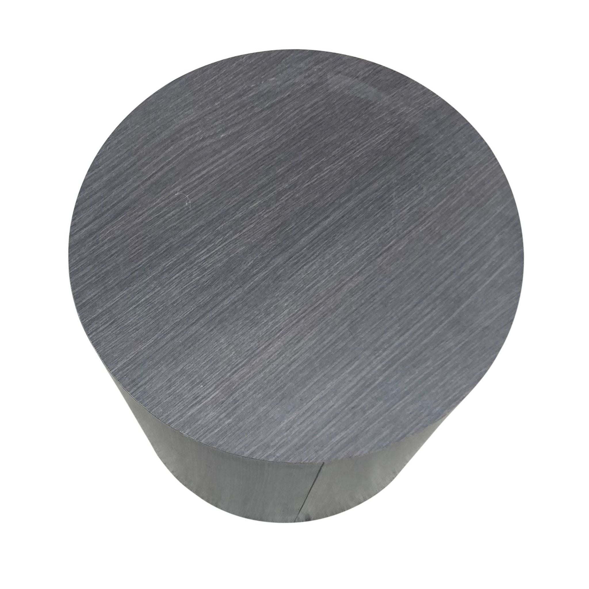 2. Top view of a round Reperch side table showcasing the textured, wood-grain detail in a dark gray finish.