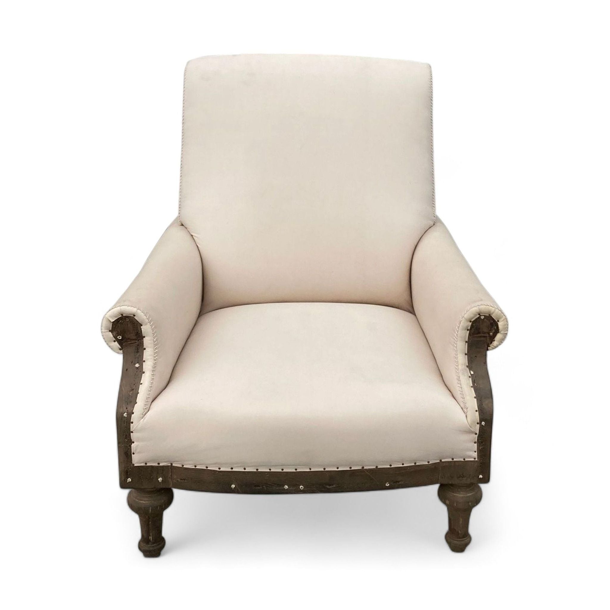 1. Restoration Hardware's 19th-century inspired club chair with exposed wooden frame and cream velvet upholstery.