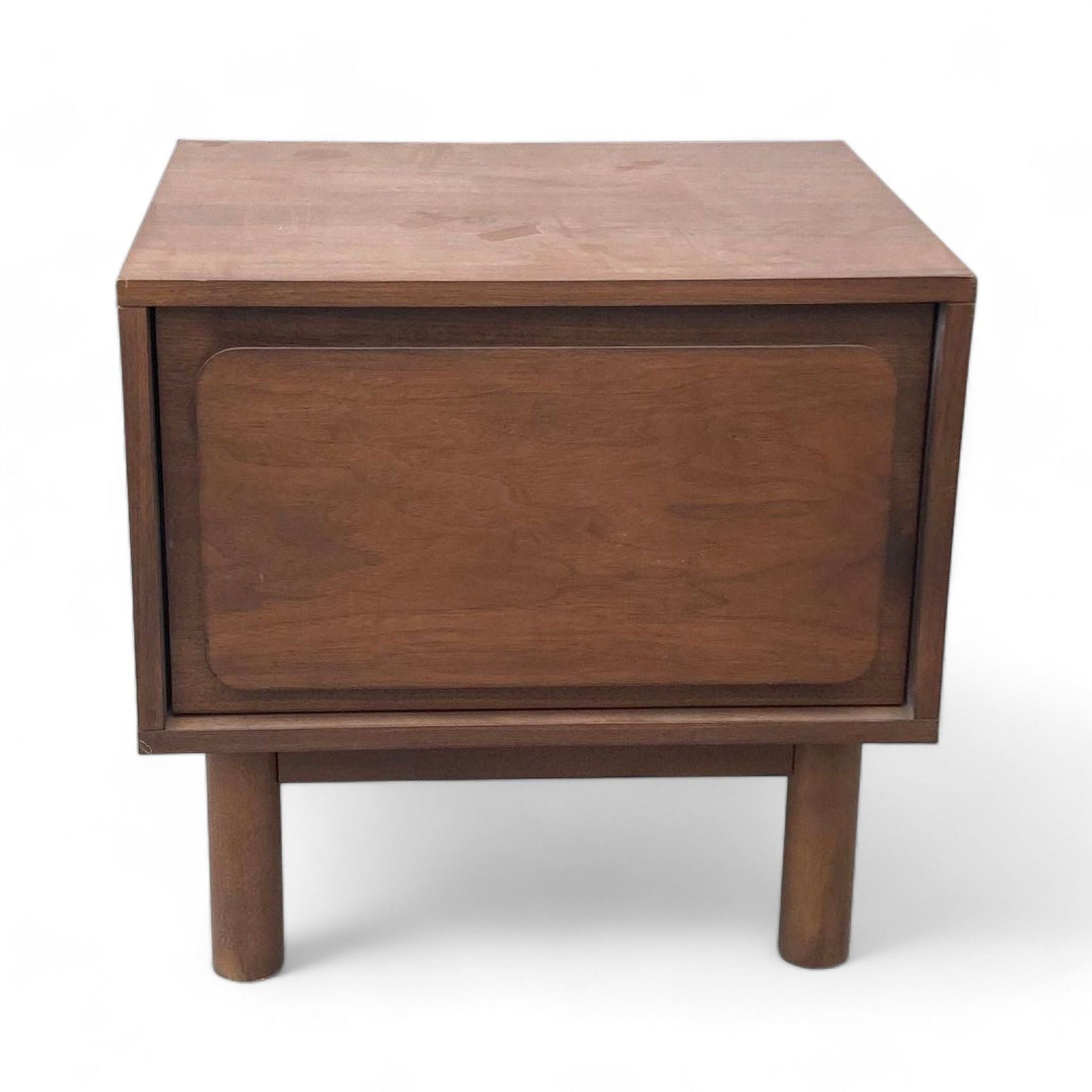 1. West Elm end table in dark walnut with closed drawer and round tapered legs on white background.