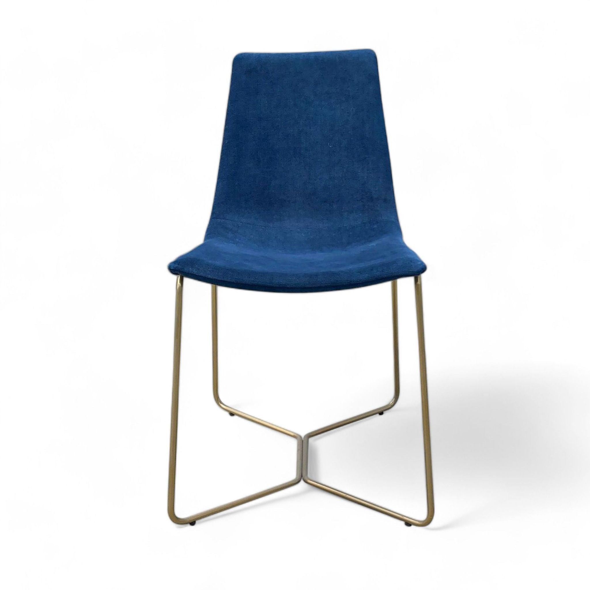 West Elm Slope dining chair, blue velvet upholstery, brass-finished metal frame, modern design.