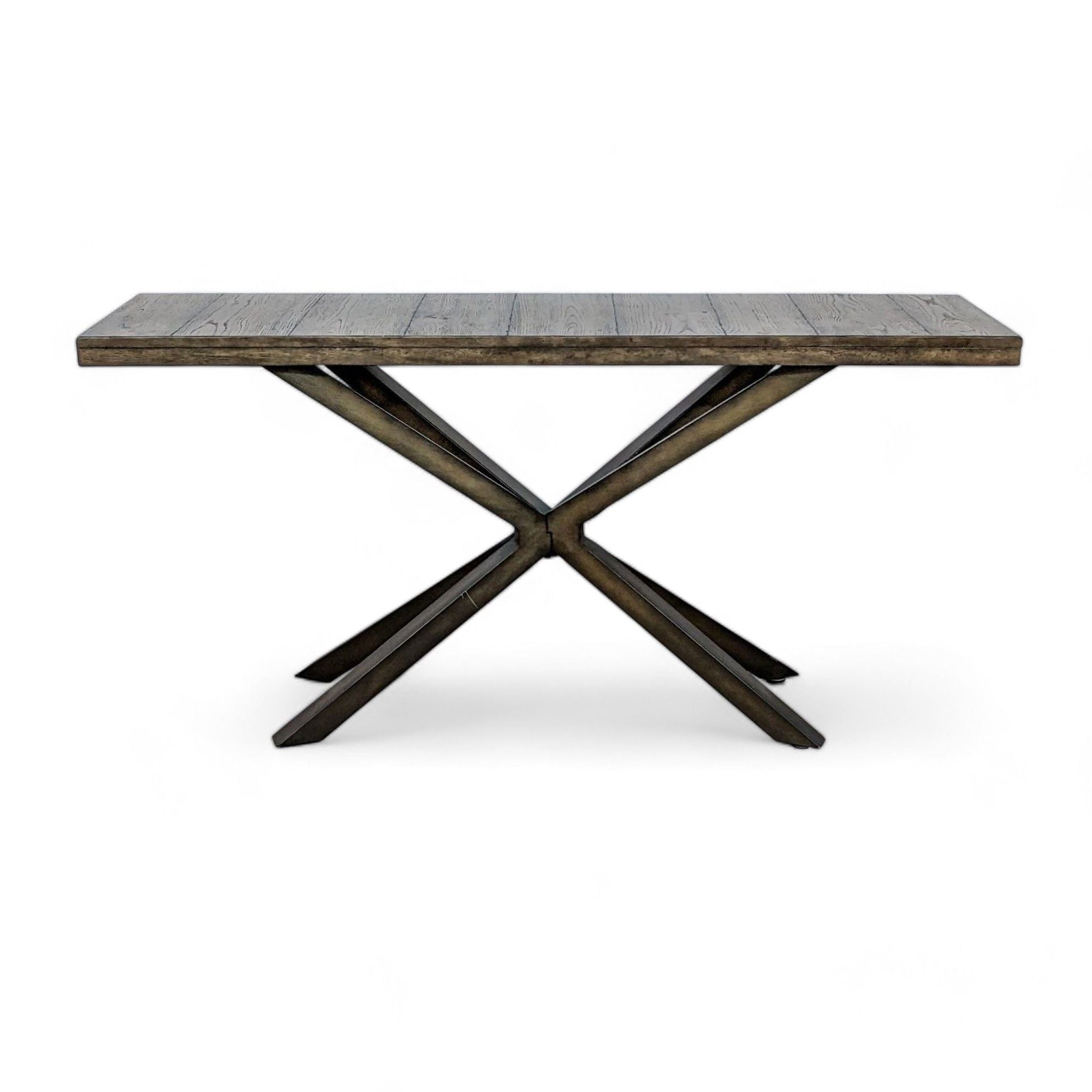 Reclaimed wood top console table with double X metal base by Pottery Barn, isoalted on white background.