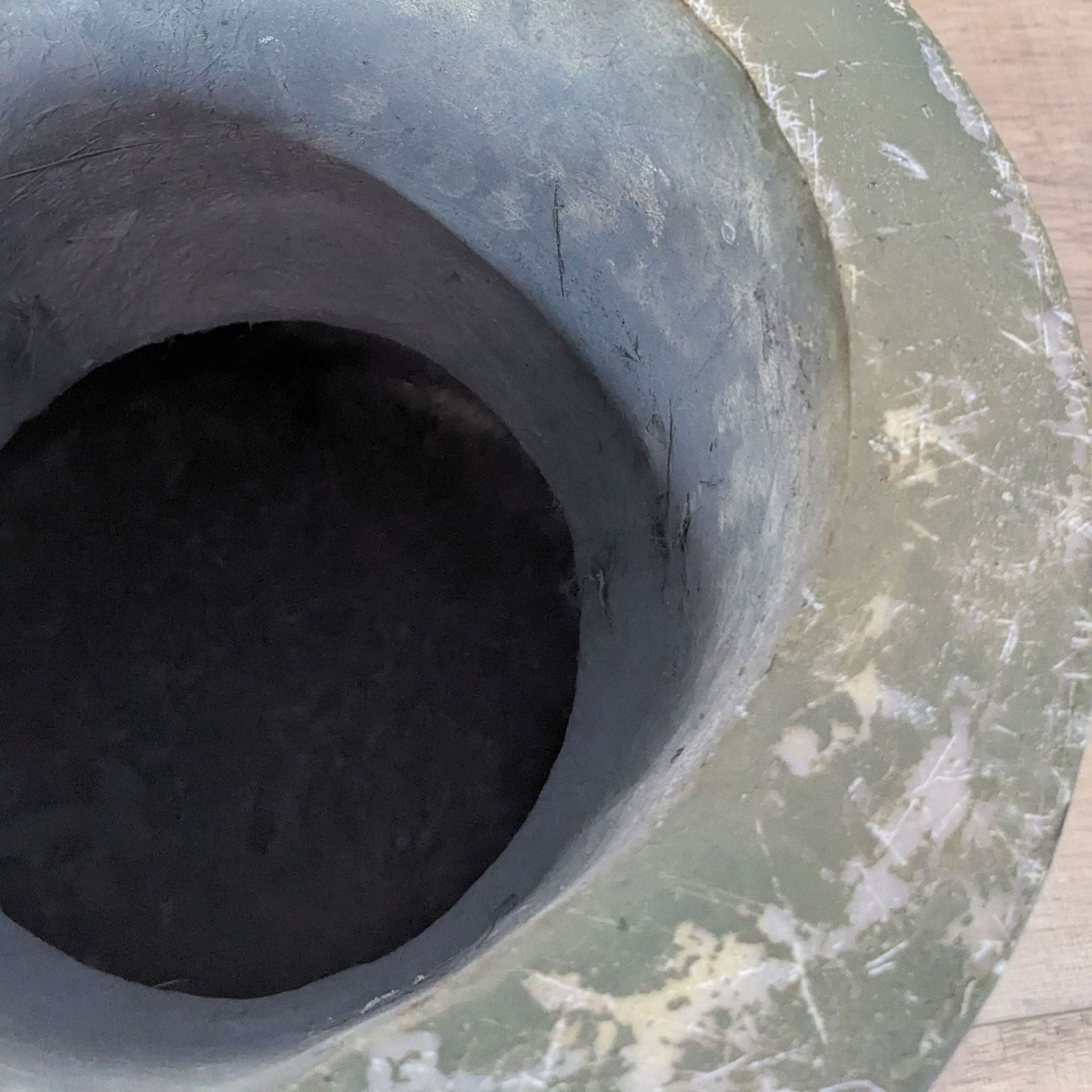 2. Top view of a durable, black side table by Article, highlighting the interior hollow space.