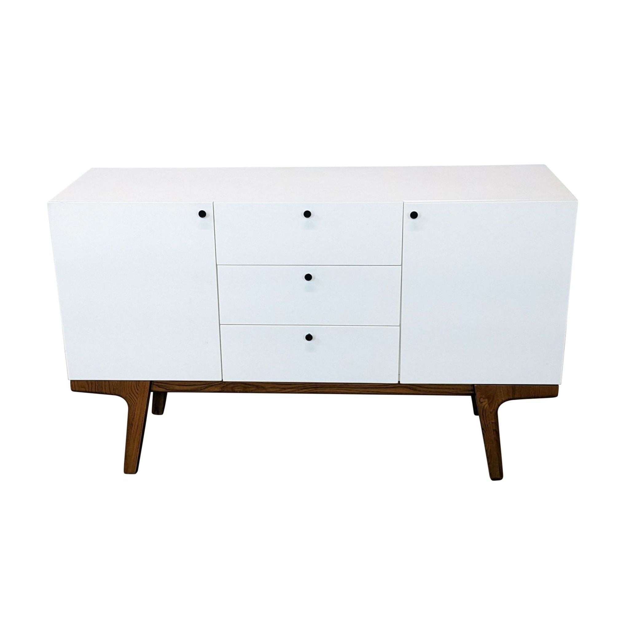 West Elm Scandinavian-style entertainment center with three drawers and solid wood legs, closed view.