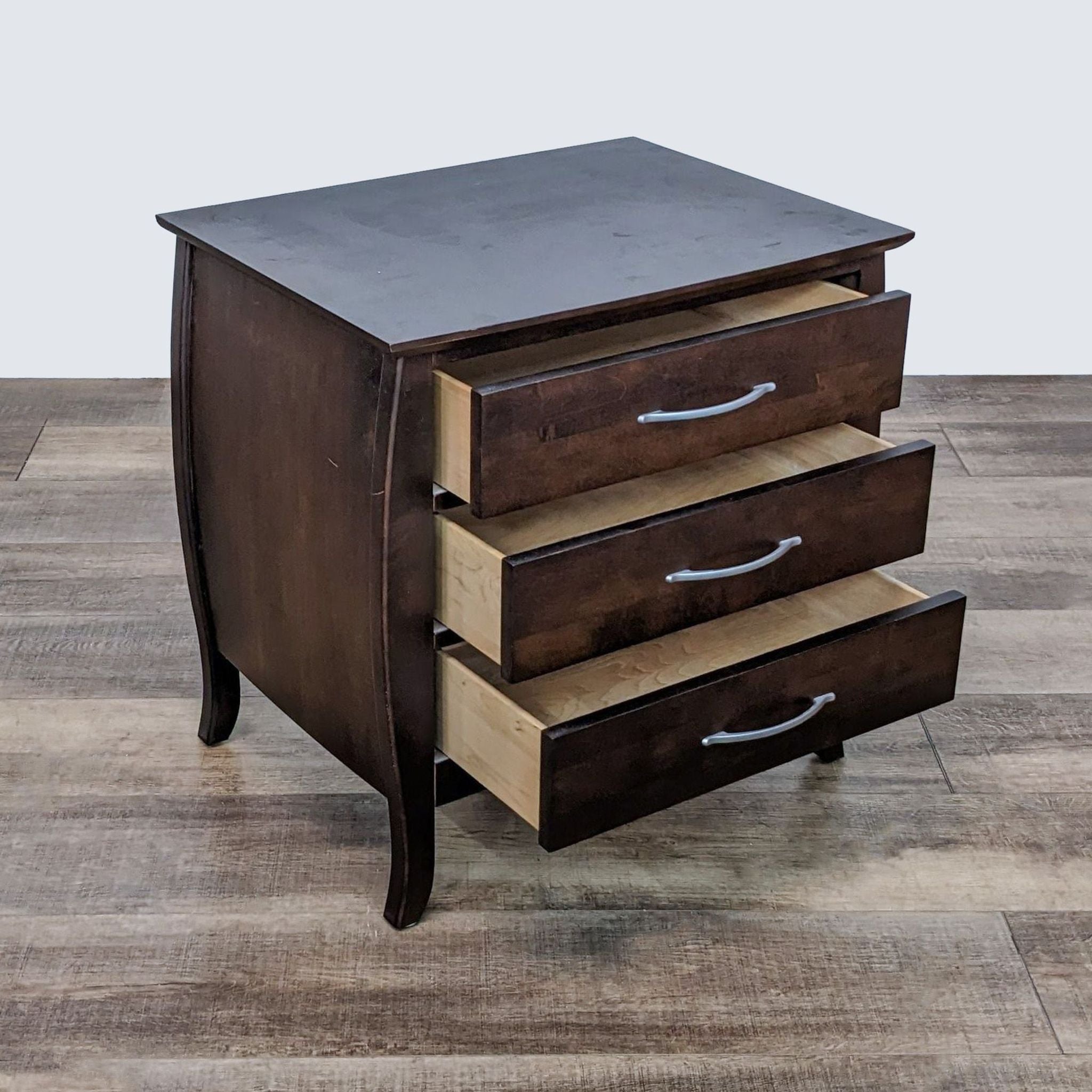 2. Open view of a Baronet Furniture dark wooden end table with three drawers partially extended.