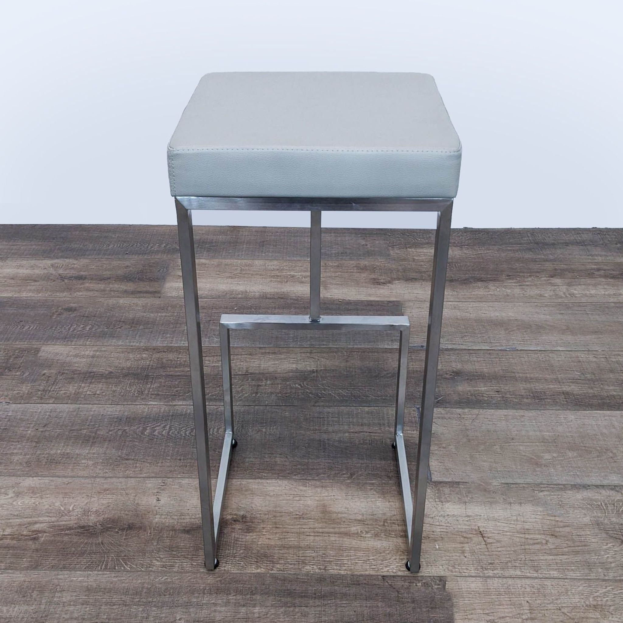 a pair of chromed stools by [ unused0 ] for [ unused0 ].