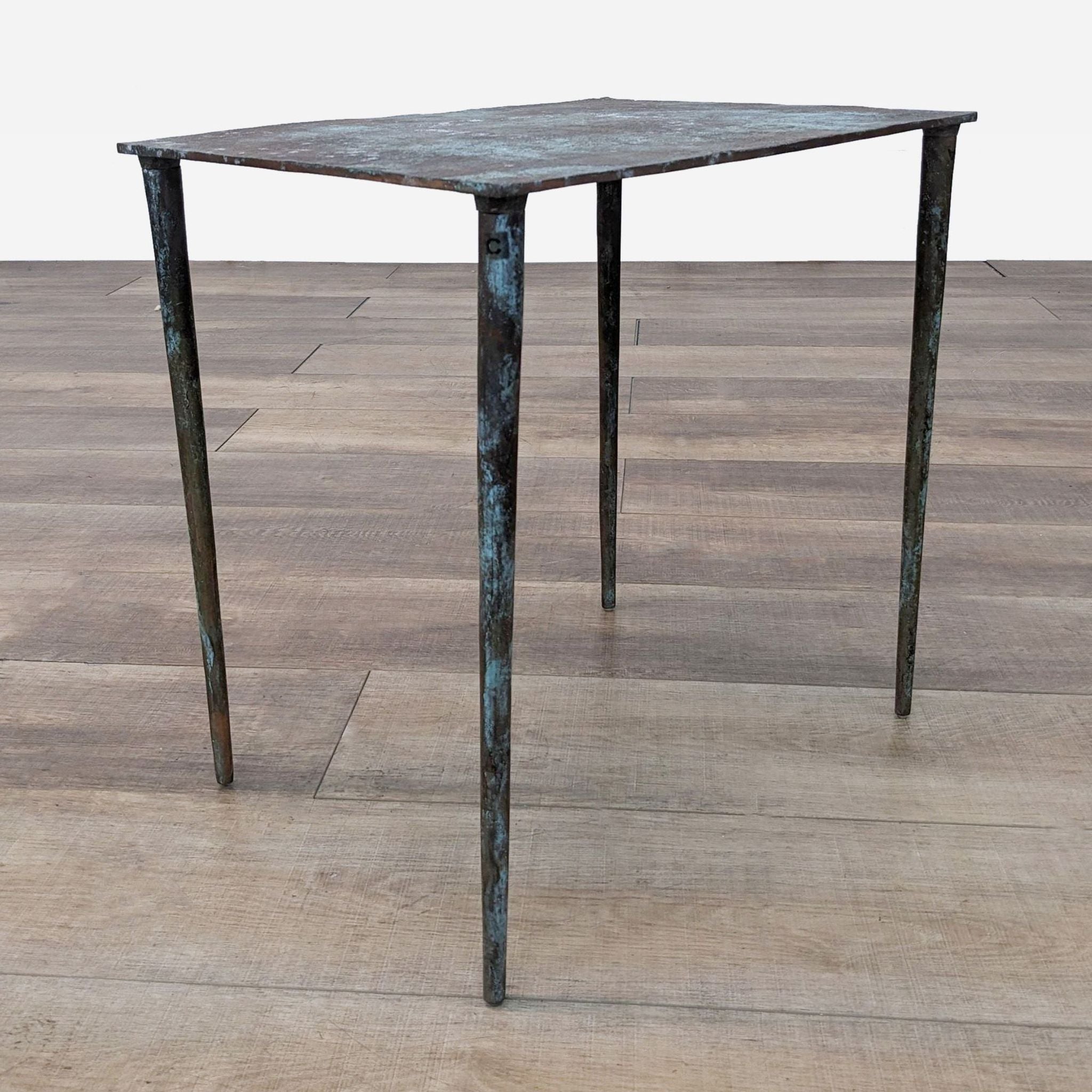 a small table with a metal base