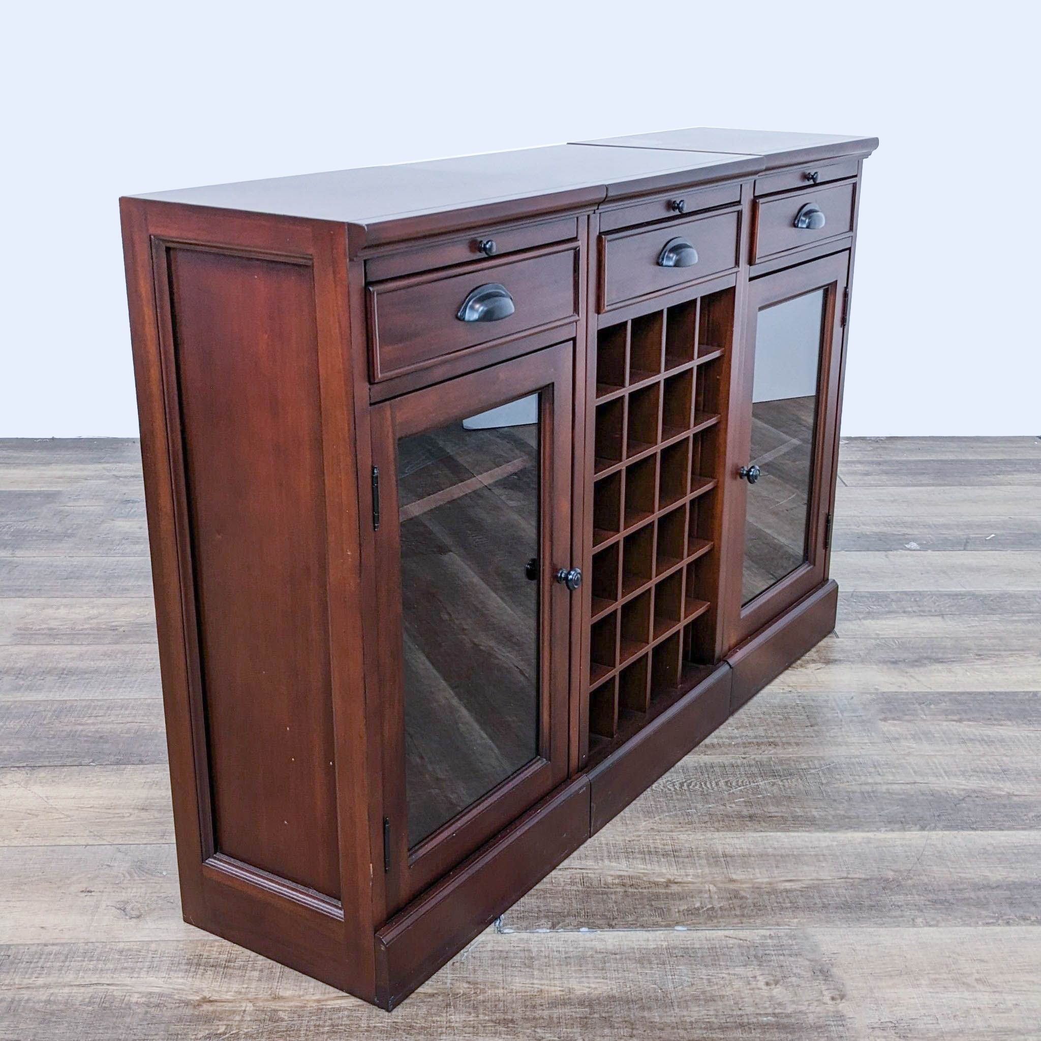 a dark cherry wood cabinet with glass doors and a glass door.