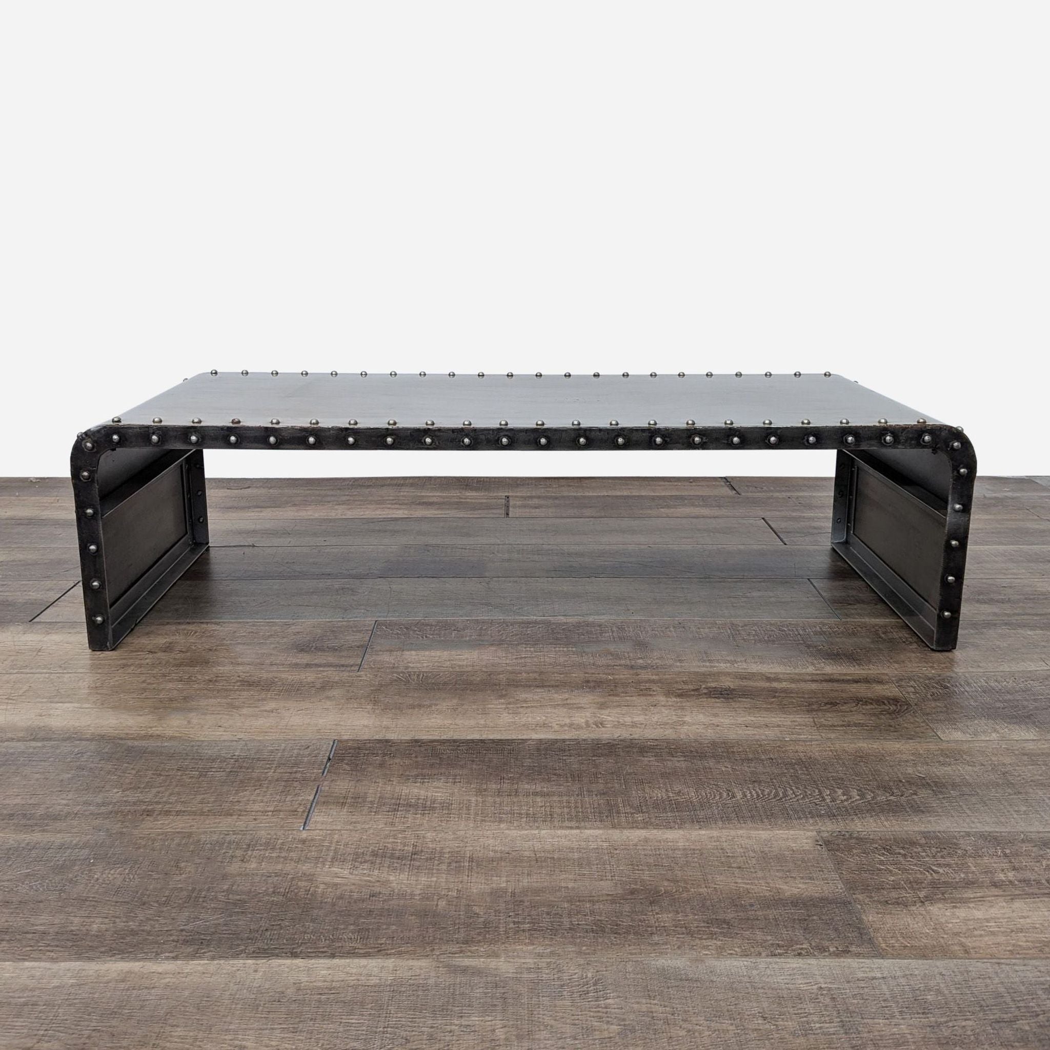 the coffee table is made from a metal frame.