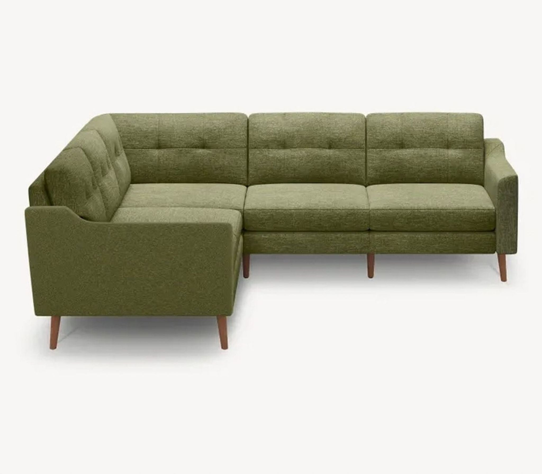 a green sofa with a wooden base.