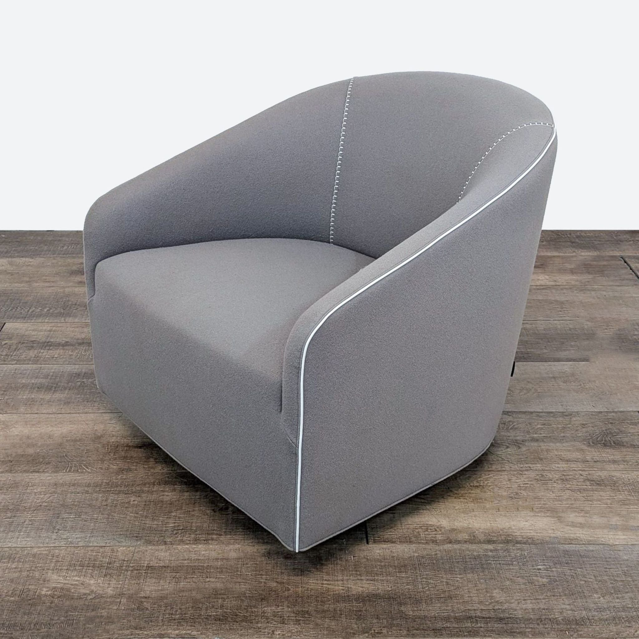 a black chair with a black cushion on it 