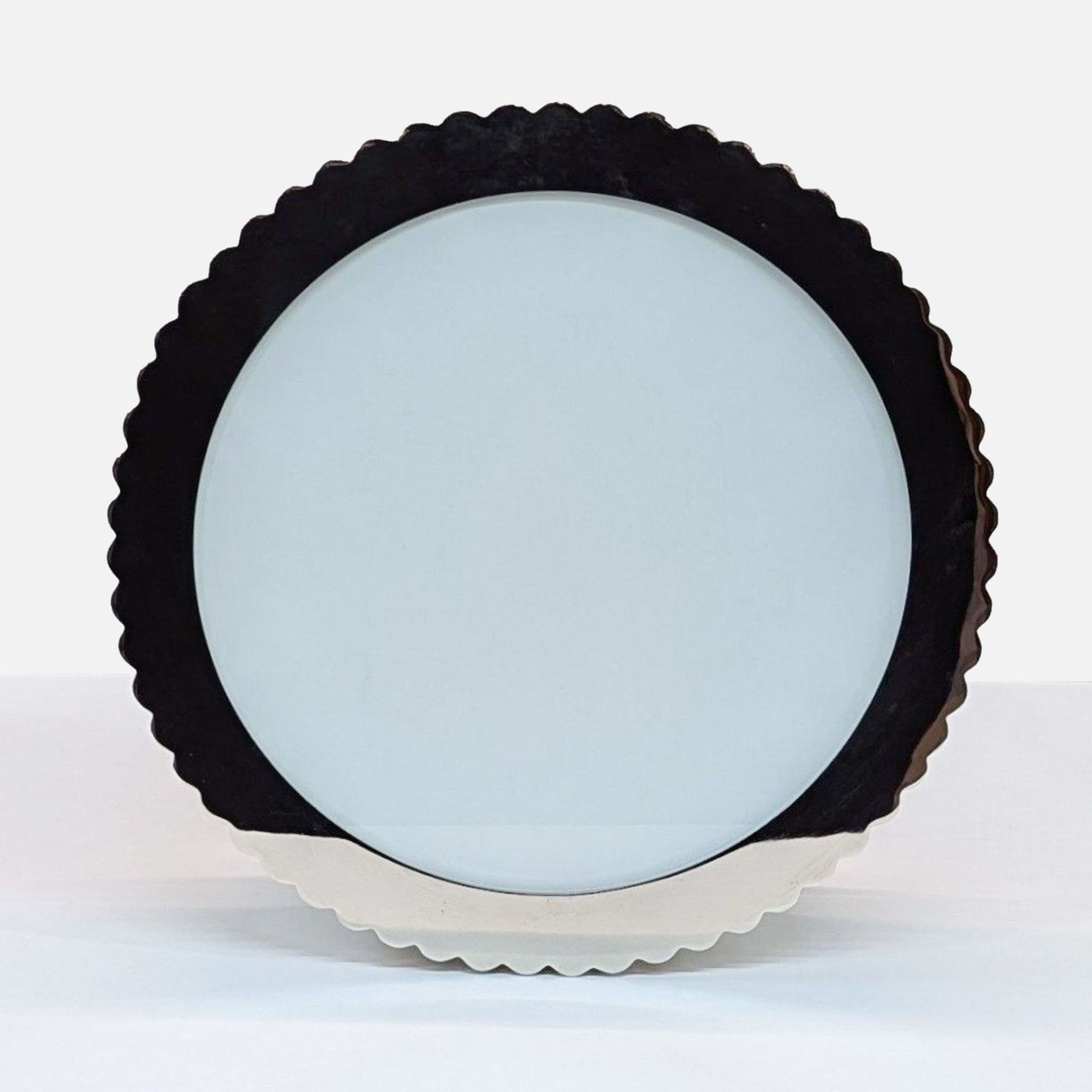 a white clock with a black face on it 
