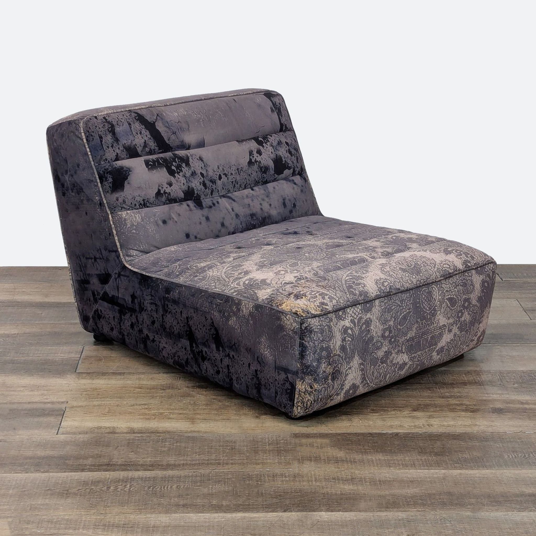 Side view of Timothy Oulton lounge seat, highlighted by textured upholstery.