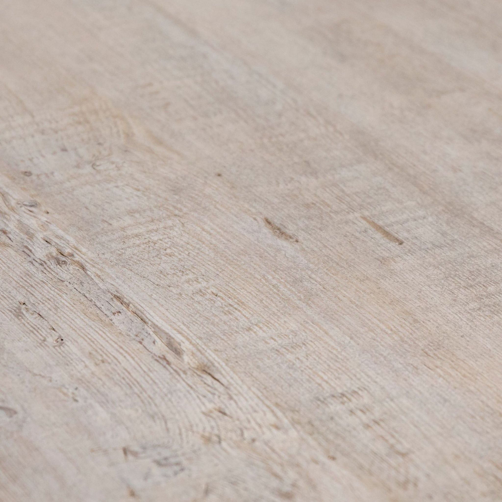 Detailed view of reclaimed pine wood grain and texture.