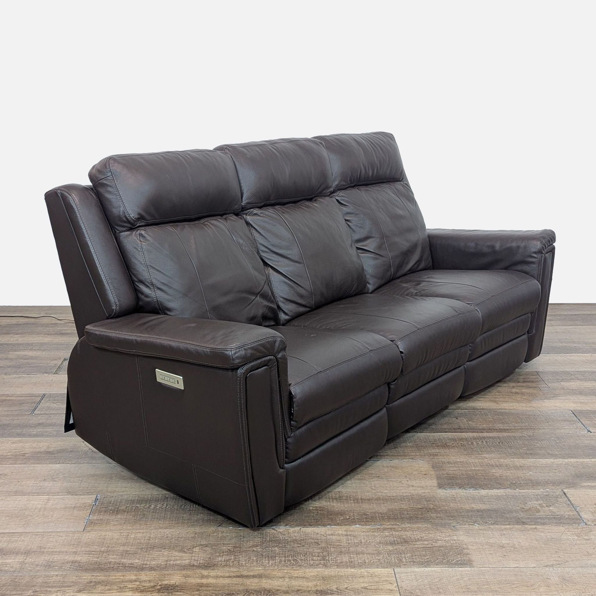 Palliser 3-seat recliner sofa with adjustable lumbar in brown leather.
