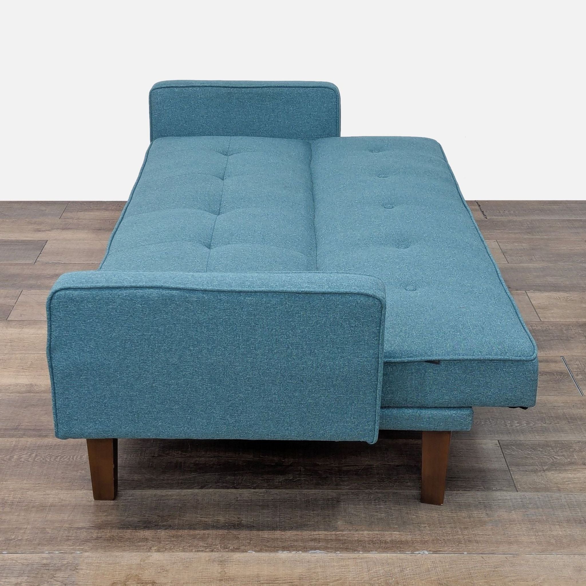 Cepkiao sofa unfolded into a sleeper, featuring durable upholstery.