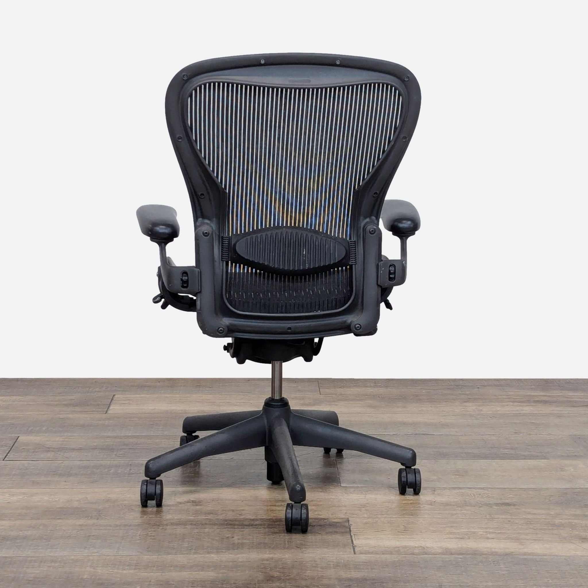 Back view of Herman Miller Aeron Chair C, sturdy design, great condition.