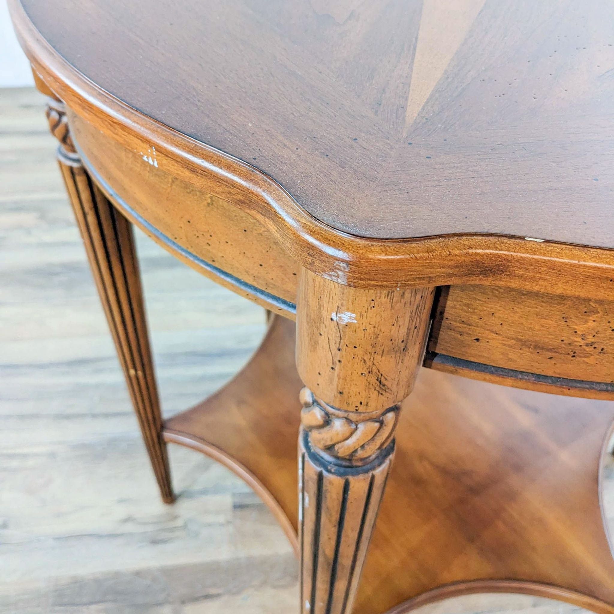 Close-up of Reperch table corner showing star pattern top and detailed leg design.