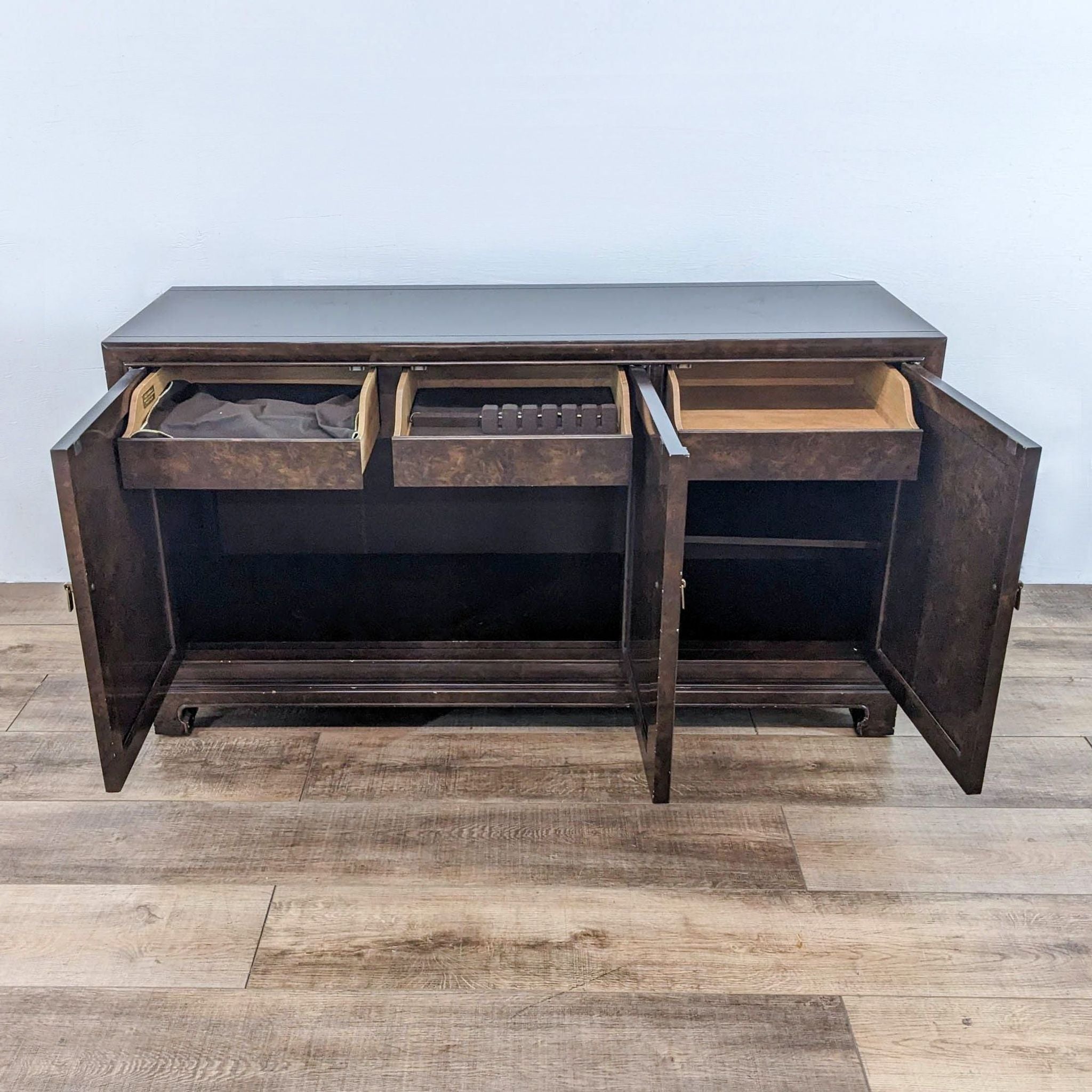 Alt text 2: Open John Widdicomb credenza showing compartments and drawers, with the brand label visible inside.