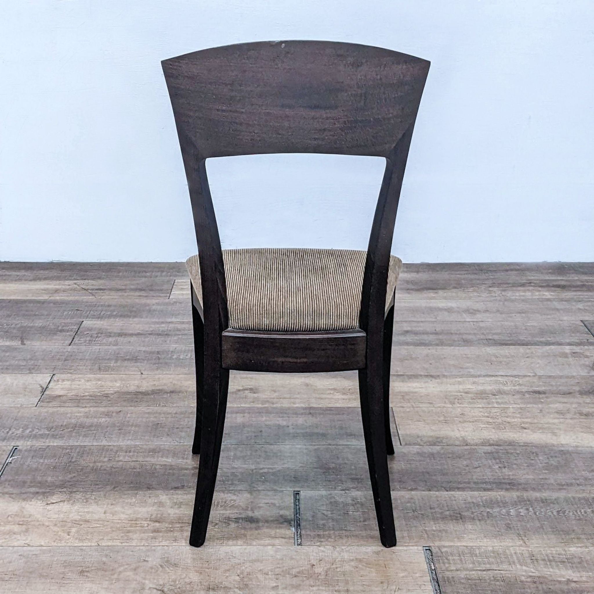 Detailed view of a teak Italian dining chair by A. Sibau, showcasing the wood grain and tan upholstered seat.