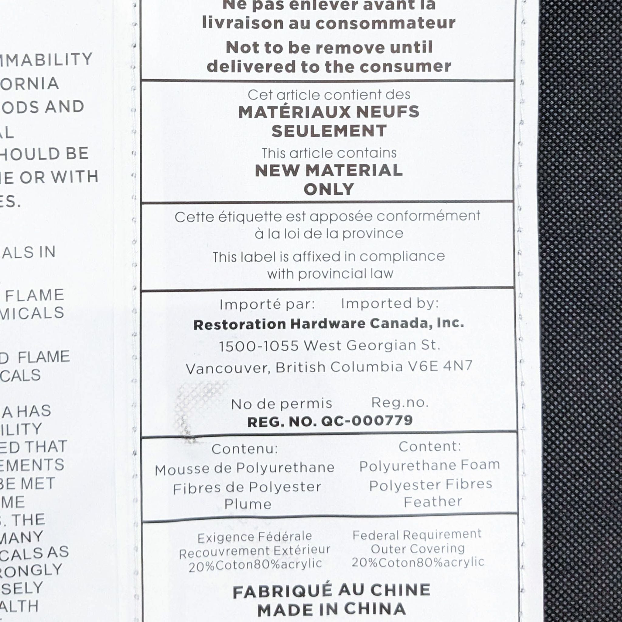 Label on a Restoration Hardware ottoman detailing brand, materials, and legal compliance in both English and French.