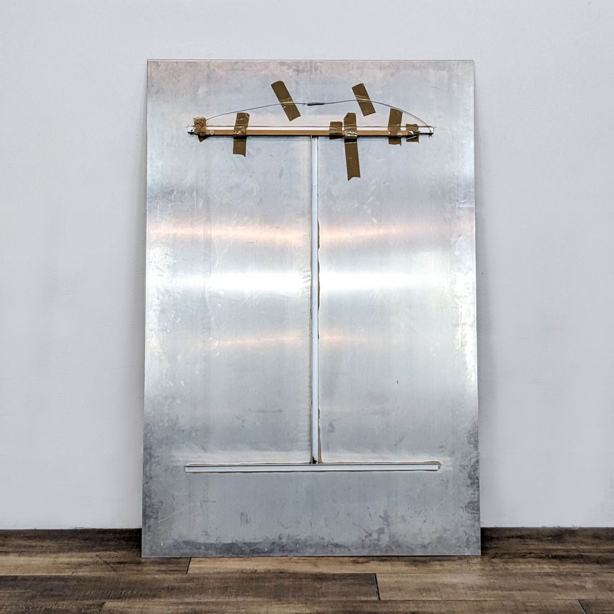 Rear view of "Dancer" aluminum print displaying mounted hanging hardware on back, by Reperch.