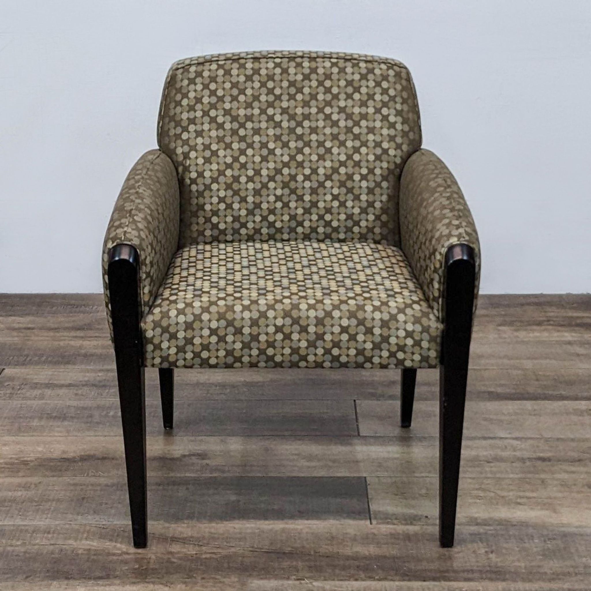 Front view of a Haworth Galerie lounge chair with patterned upholstery and tapered wood legs.