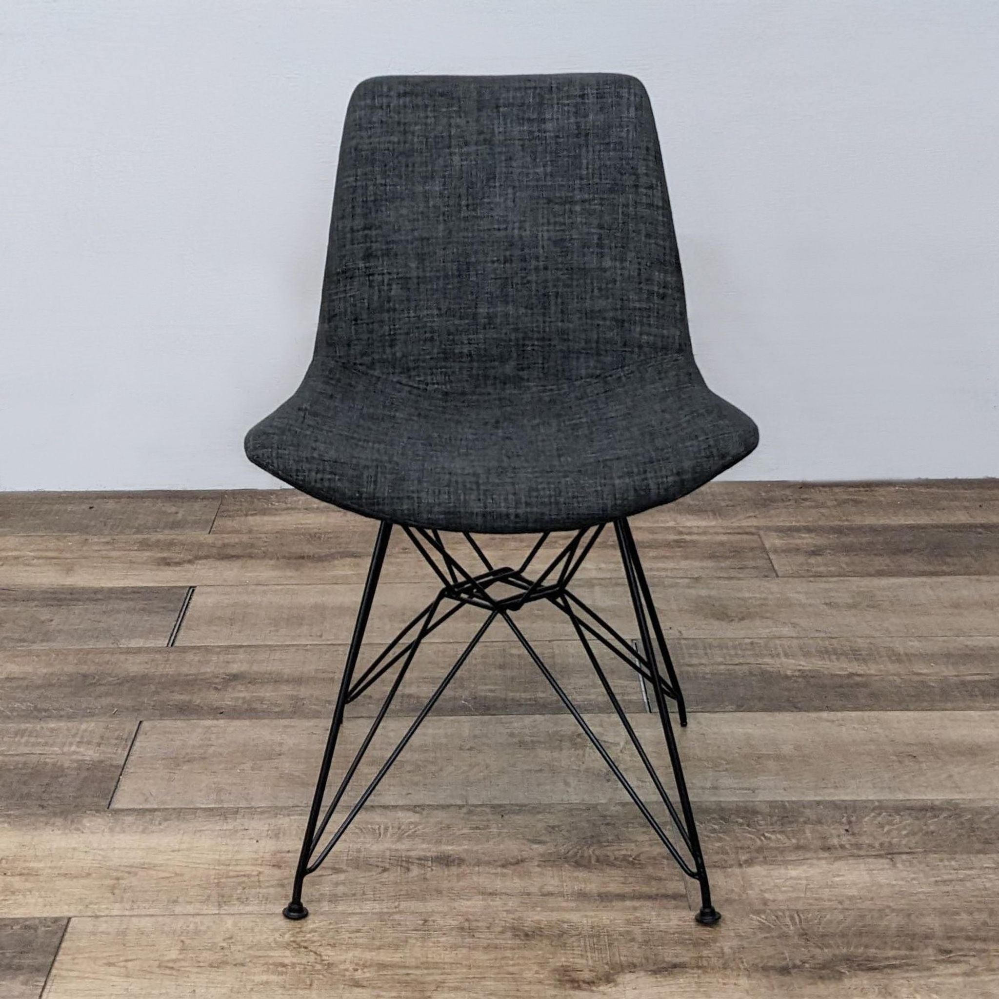 Armen Living's Palmetto Chair with a black metal frame and grey fabric seat, shown from the front.