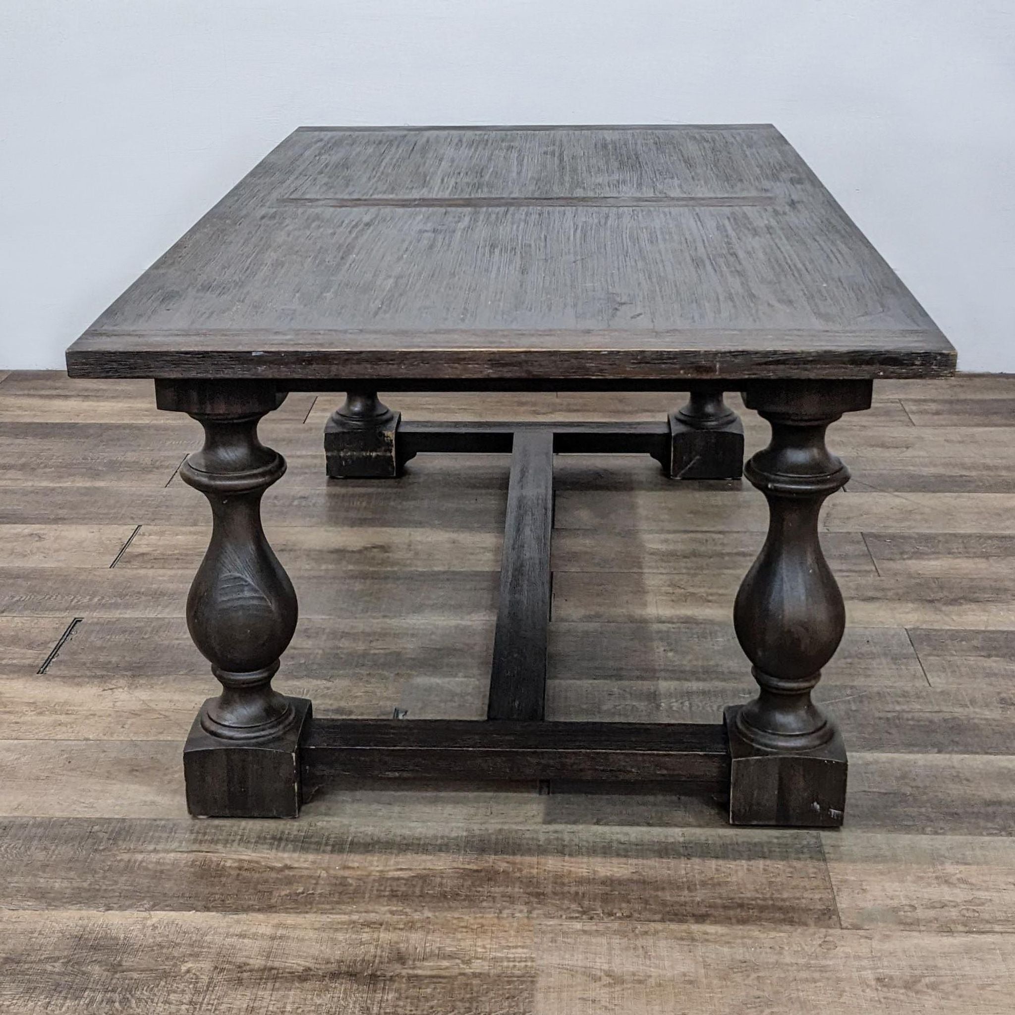 Restoration Hardware traditional dining table featuring acacia, fine veneers, and baluster trestle legs from a 17th-century inspired design.