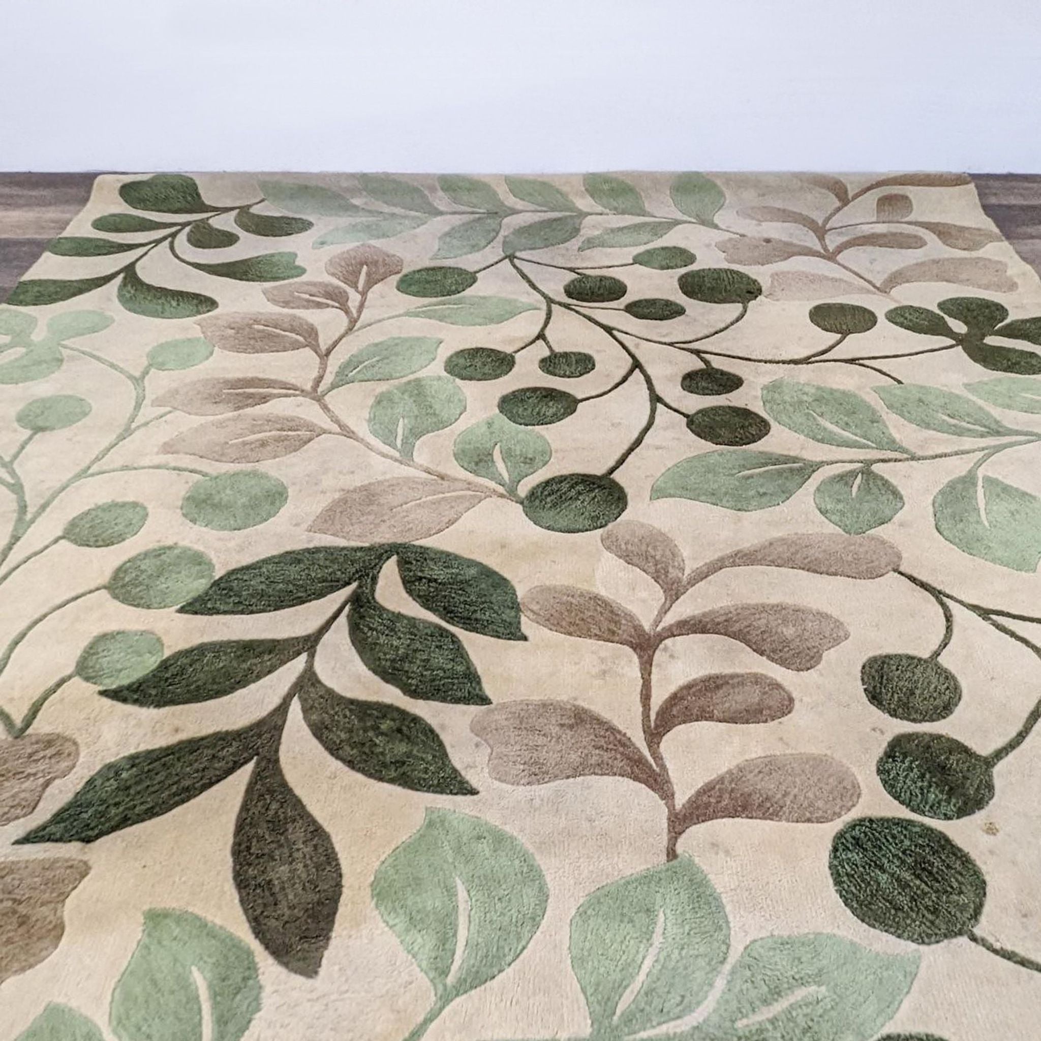 Nourison Contours Collection rug with carved oversized leaves and branches on a vanilla background.
