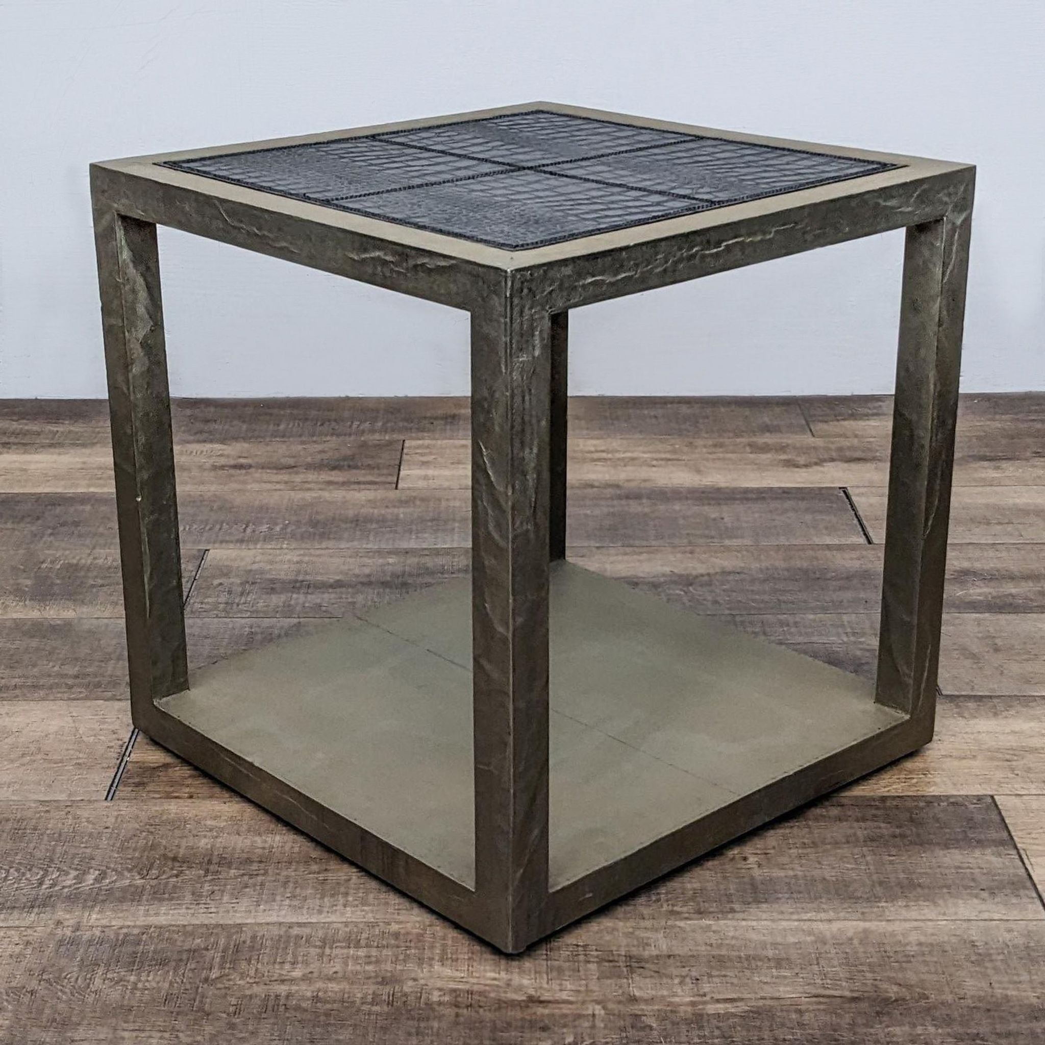 Square-shaped end table with faux crocodile skin texture and glass shelf by Reperch, in a neutral-toned setting.