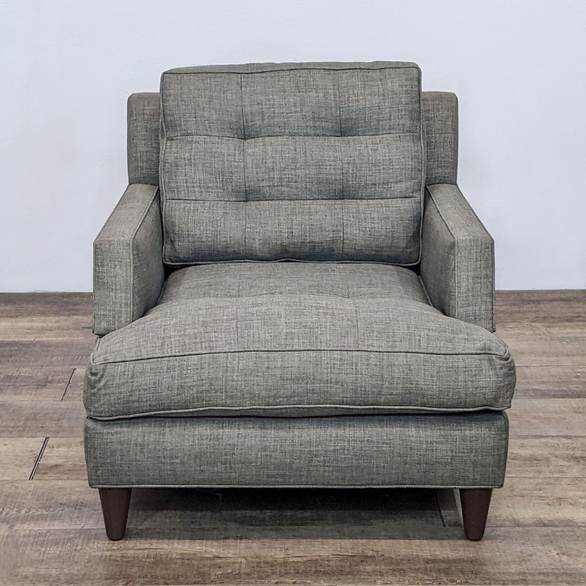 Reperch contemporary lounge chair with tufted back, square arms, and tapered wood feet, in a gray fabric.