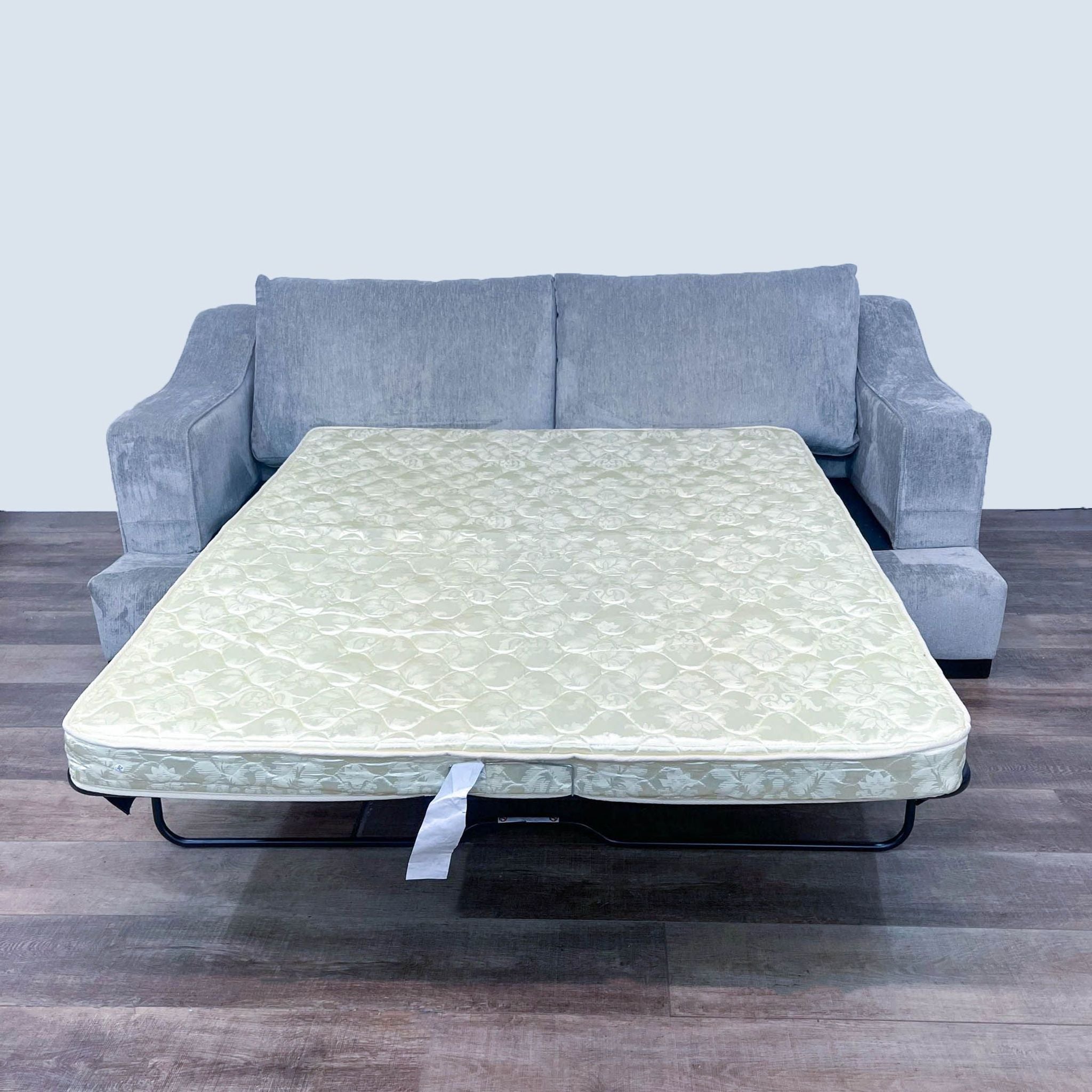 Living Spaces Queen Mattress from Lodge Sleeper Sofa, unfolded, showcasing the Leggett and Platt mechanism.