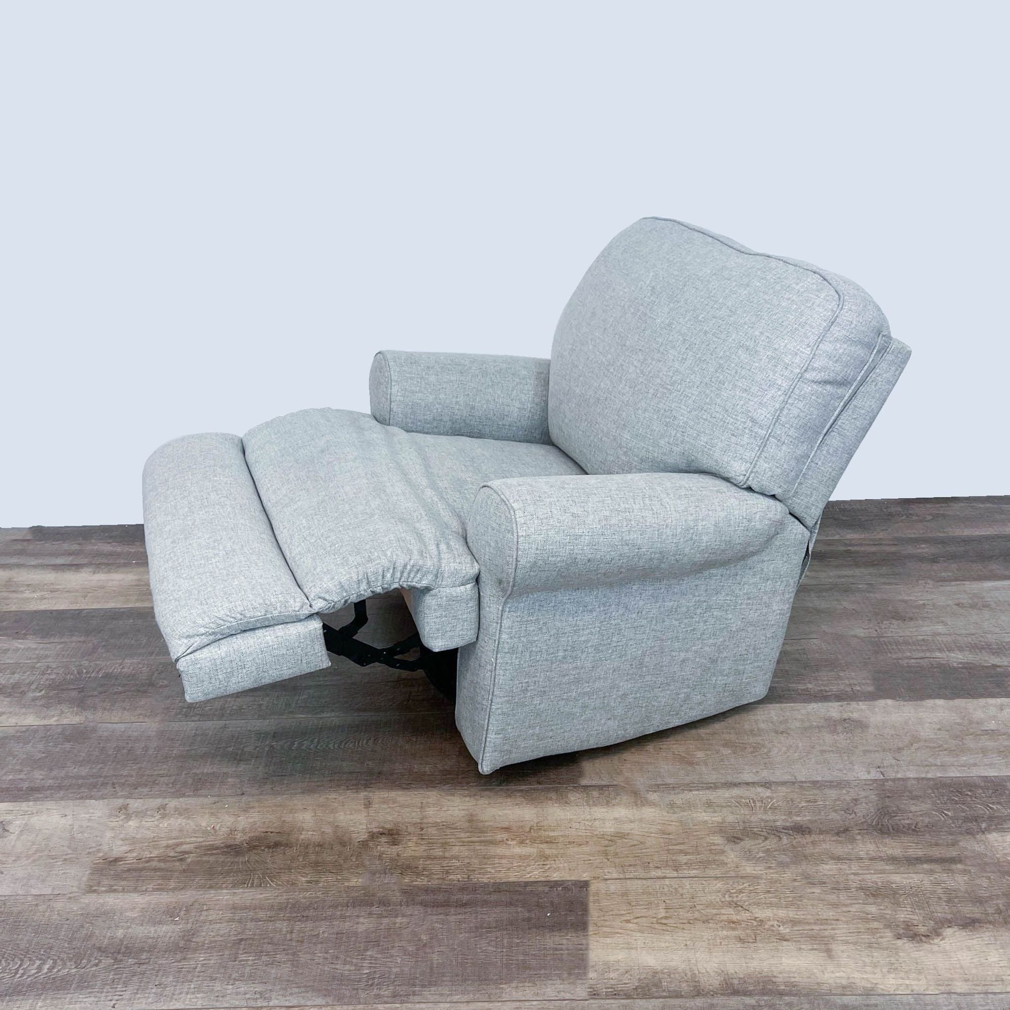 Contemporary Ferncliff lounge chair with easy recline feature, upholstered in neutral fabric, displayed in partially reclined position.