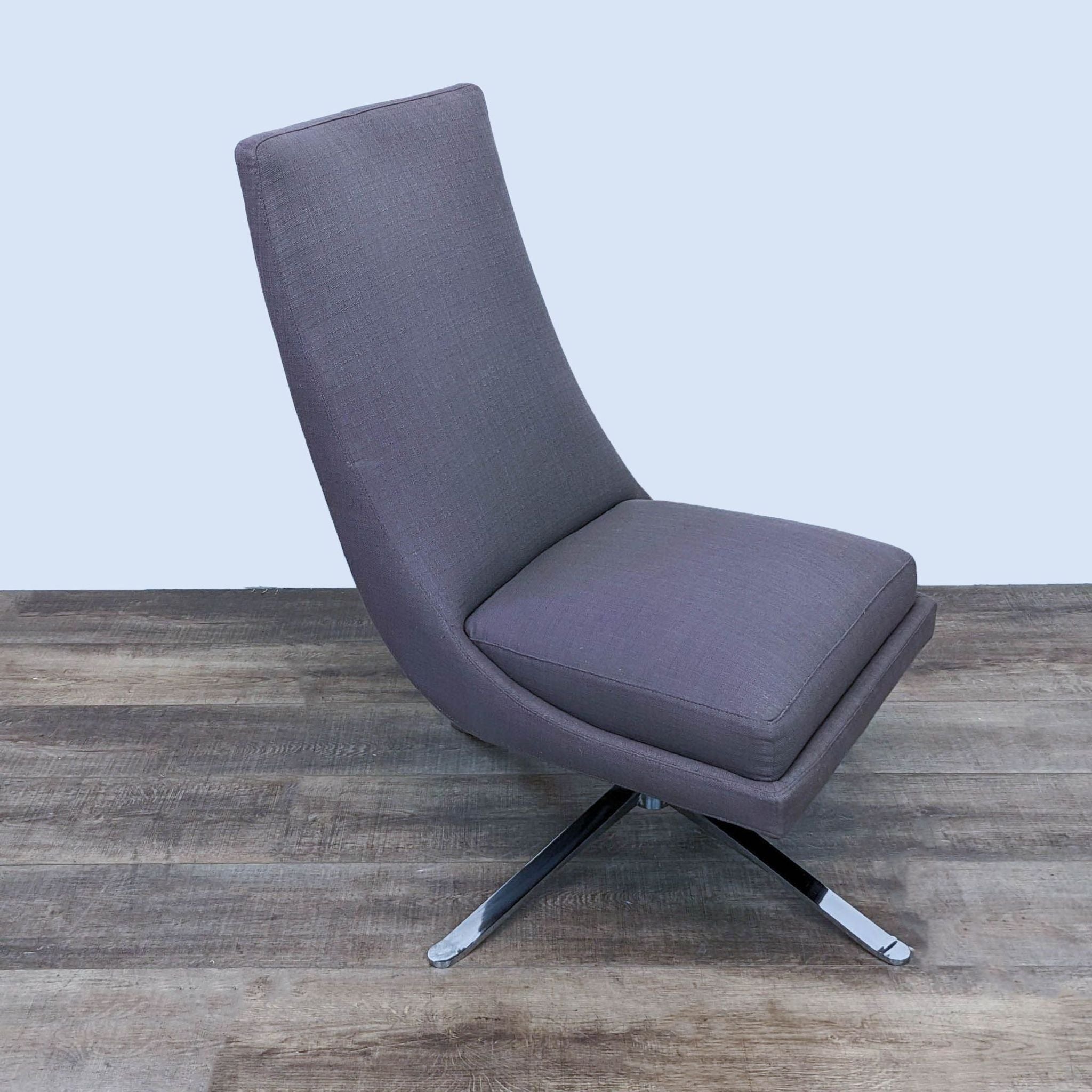 Reperch contemporary lounge chair in gray fabric, featuring high back and chrome star-shaped swivel base, displayed in side view.