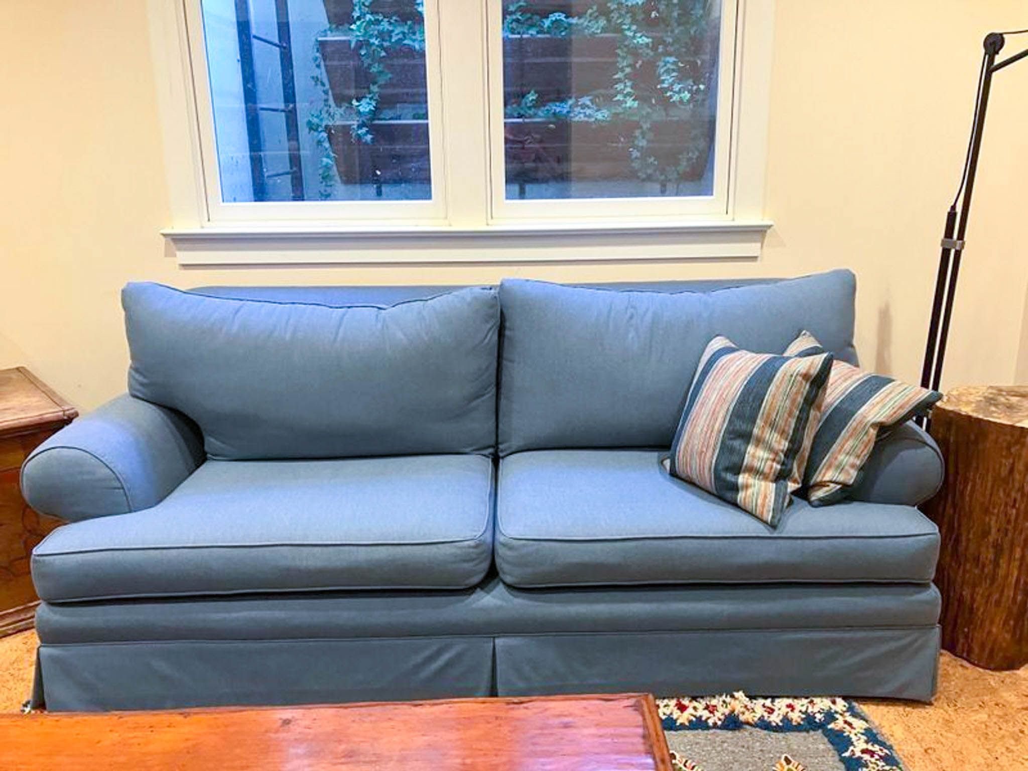 Blue Reperch 3-seat fabric sofa with roll arms and T-back cushions, displayed in a cozy room setting.