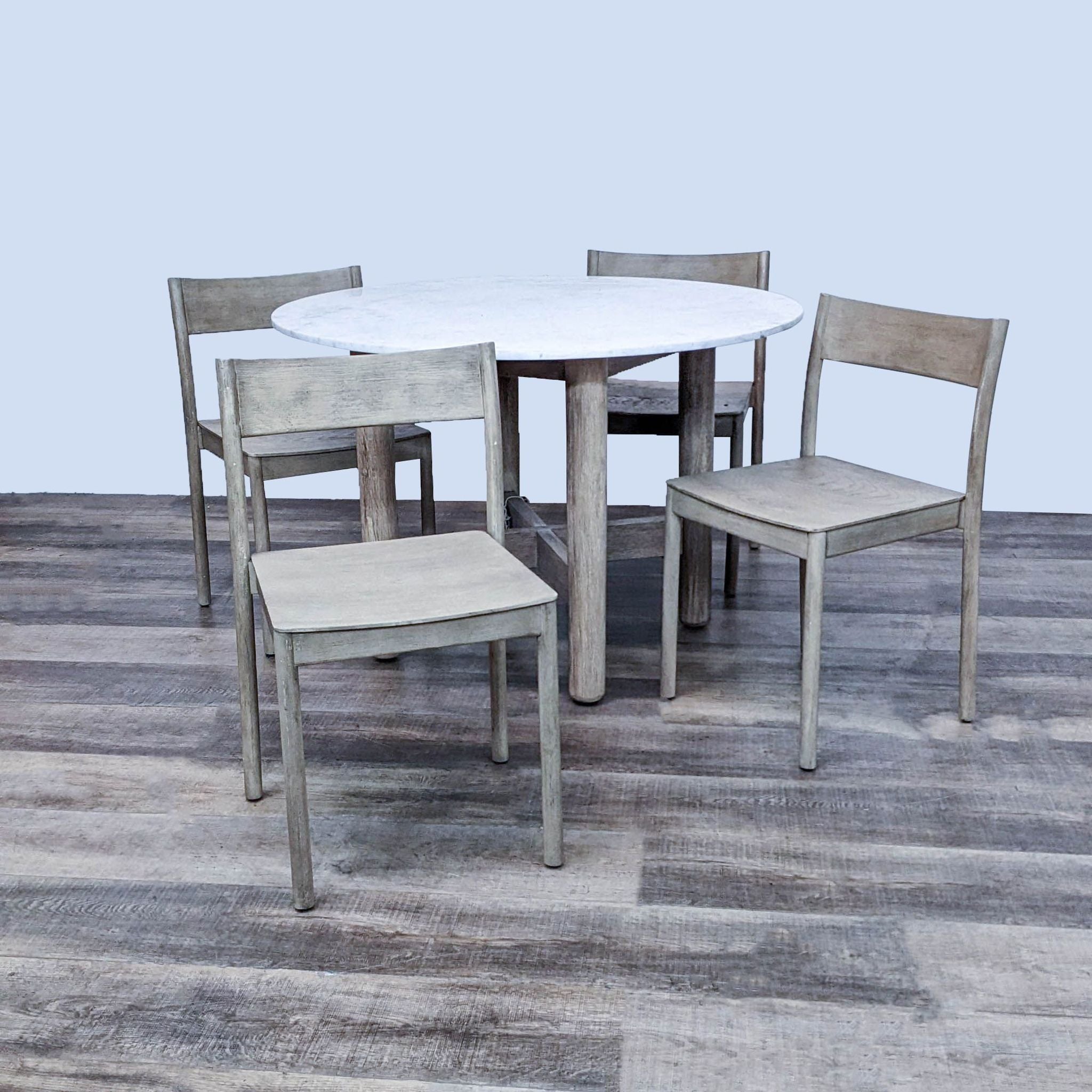 West Elm 5-piece dining set with Hargrove round marble top table and four Berkshire chairs in Dune finish.