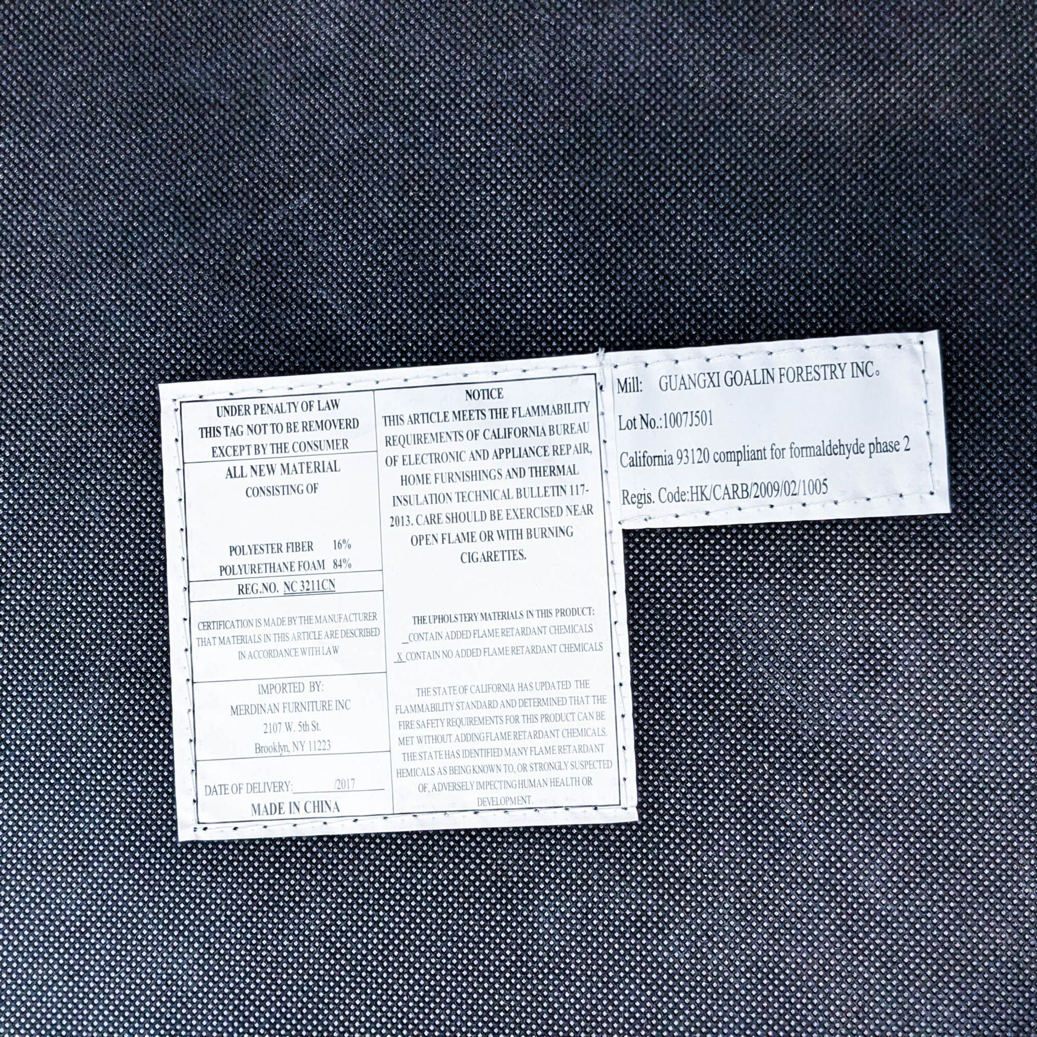 Label affixed under the chair with legal and product information, indicating Meridian Furniture as the importer.